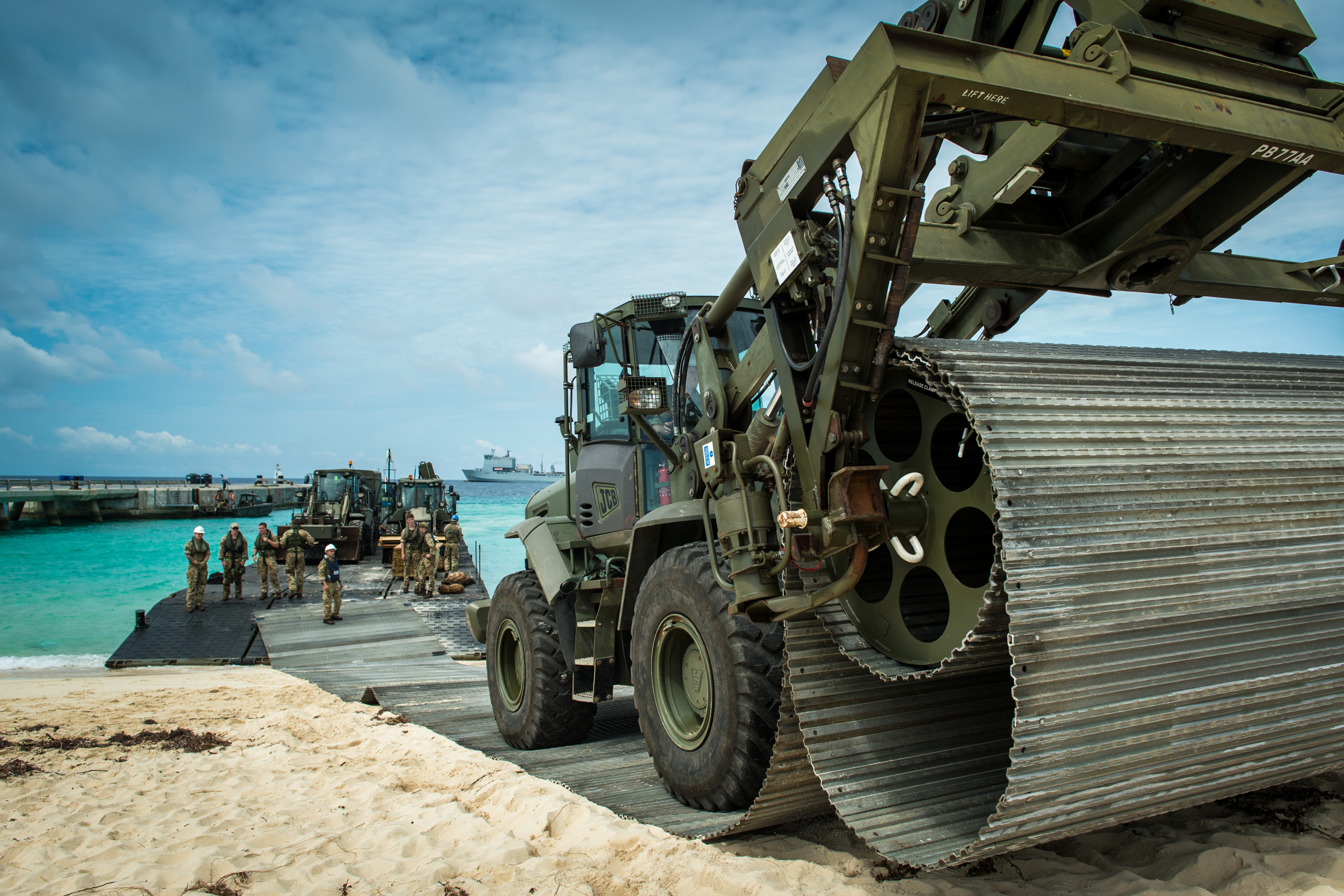 Mexifloat unloading on the beach at Grand Tuck with Heavy Plant for use in the rebuild after the hurricane that hit the Carribean, part of Operation RUMAN 
