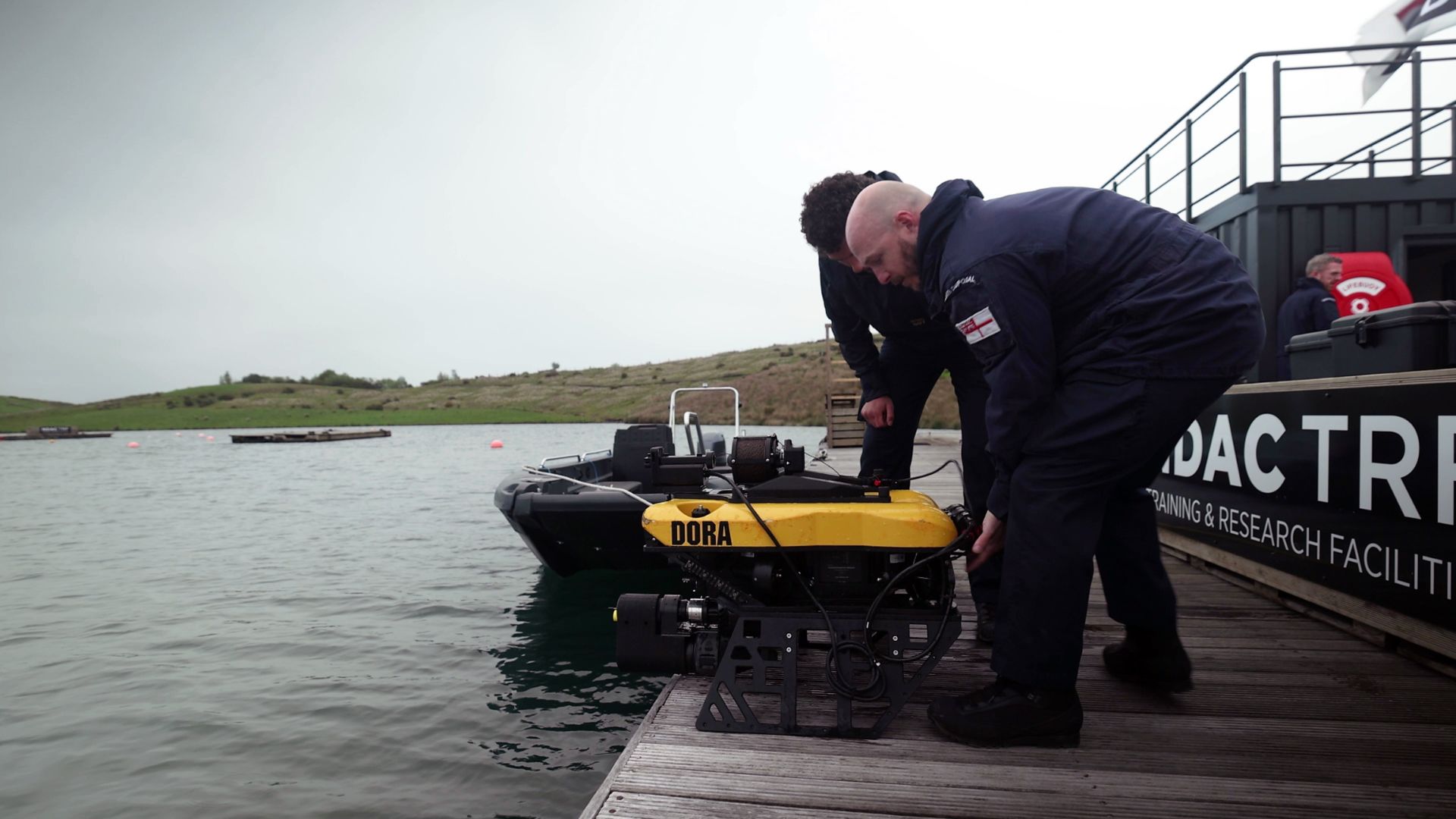 Two Royal Navy divers prepare to launch Defender on a practice run (Picture: Royal Navy)