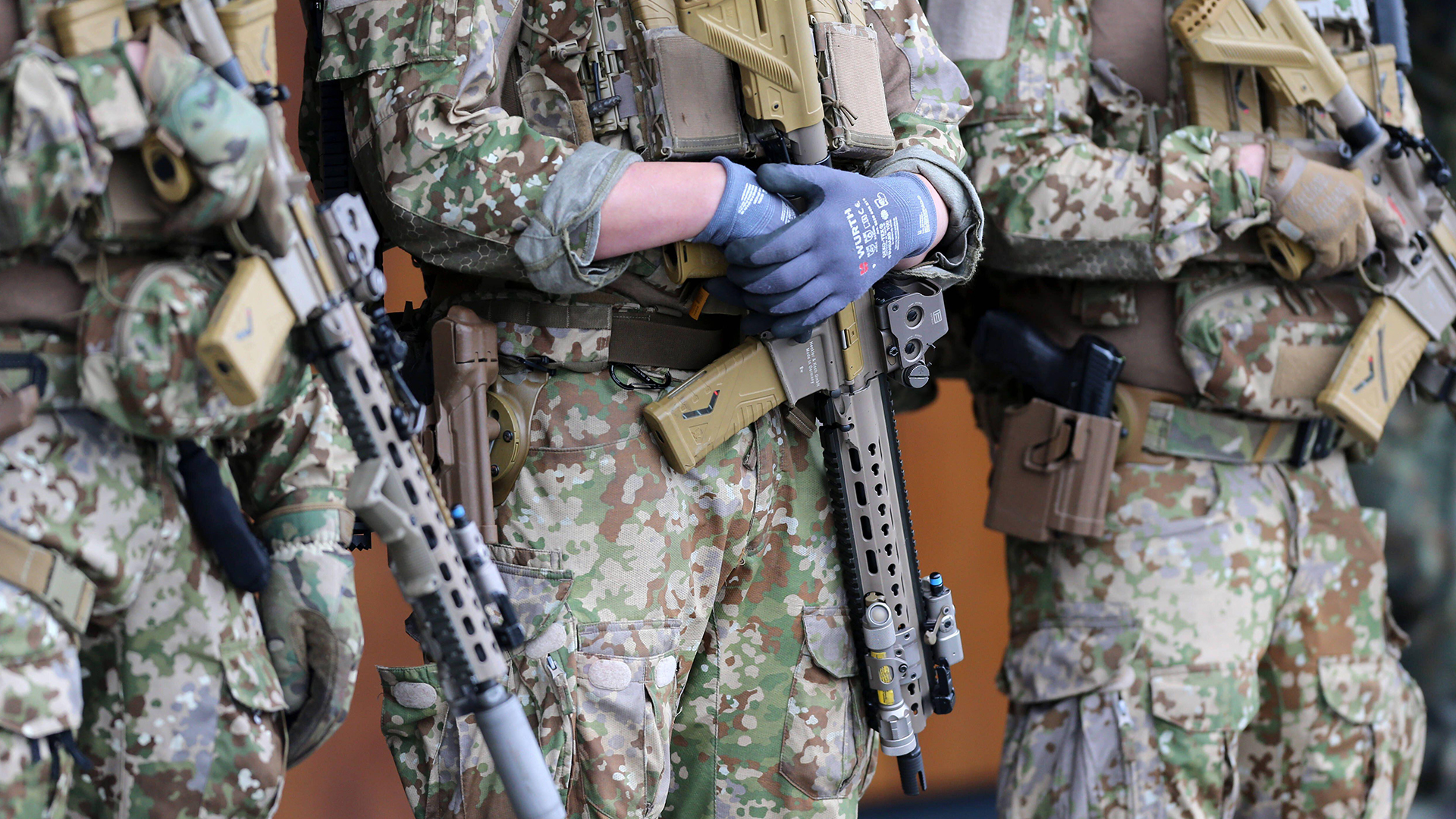 Special Forces soldiers armed with Heckler Koch G95K rifles show off their Multitarn pattern uniforms