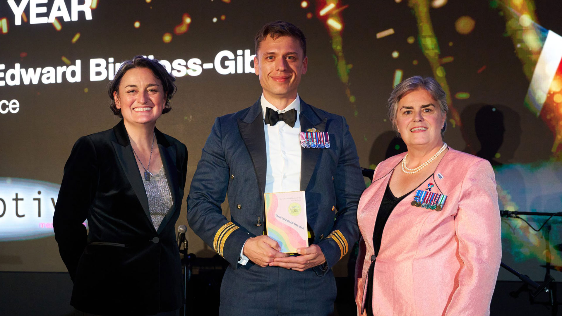 Sqn Ldr Edward Bindloss-Gibb (centre) won Team Leader Of The Year at the 2025 LGBTQ+ Defence Awards (Picture: LGBTQ+ Defence Awards)