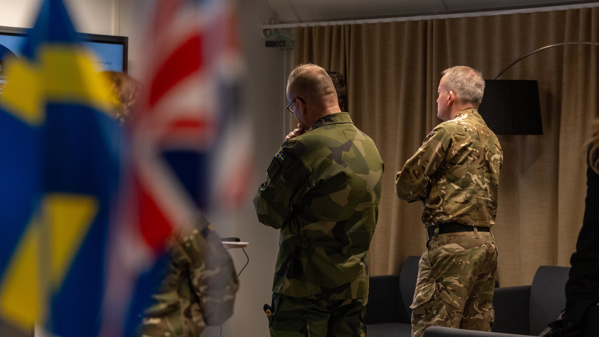 CDS met his counterpart General Michael Claesson, Supreme Commander of the Swedish Armed Forces both men have backs turned standing next to flags