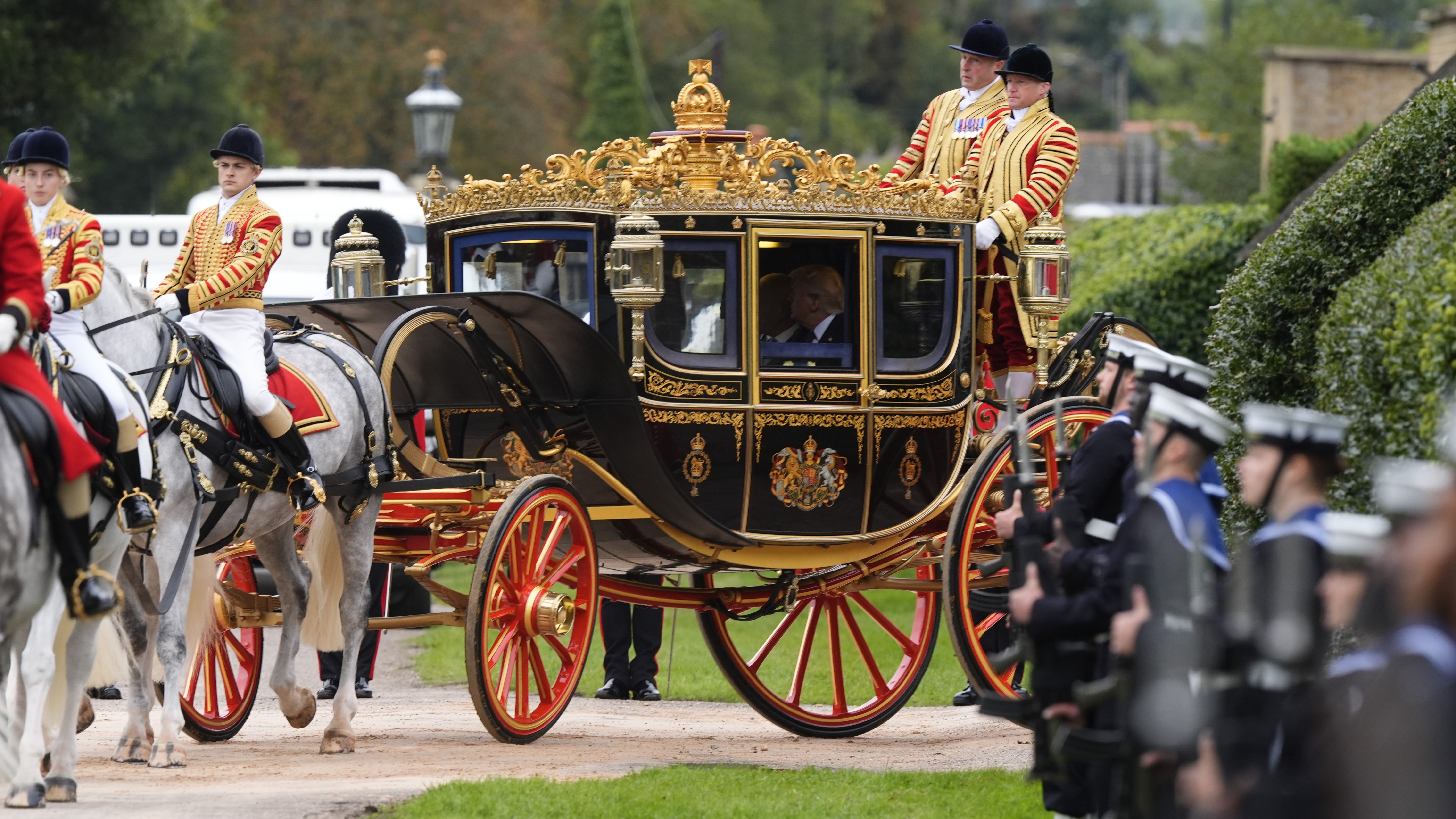 King Charles III and US President Donald Trump during the carriage procession to Windsor Castle, Berkshire, ahead of the ceremonial welcome on day one of the US President's second state visit to the UK.