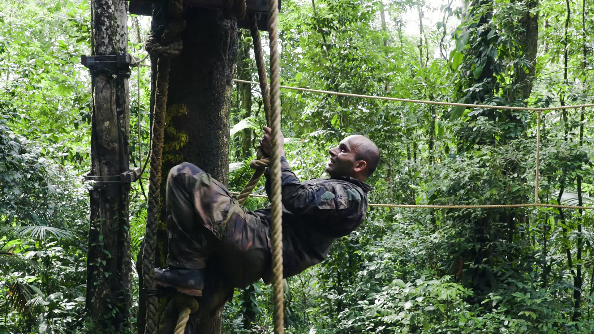 A member of personnel at the training centre climbing on a rope