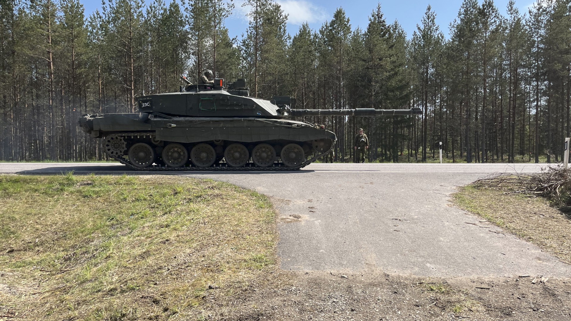 A Challenger 2 tank drives on a road during Ex Spring Storm in Estonia (Picture: BFBS)