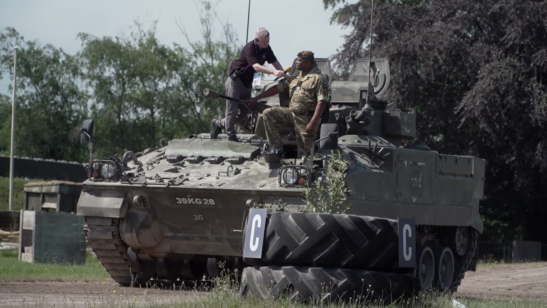 A warrior is reunited with his Warrior as WO1 Johnson Beharry prepares to drive  the infantry fighting vehicle round the display arena at the Tank Museum (Picture: The Tank Museum)