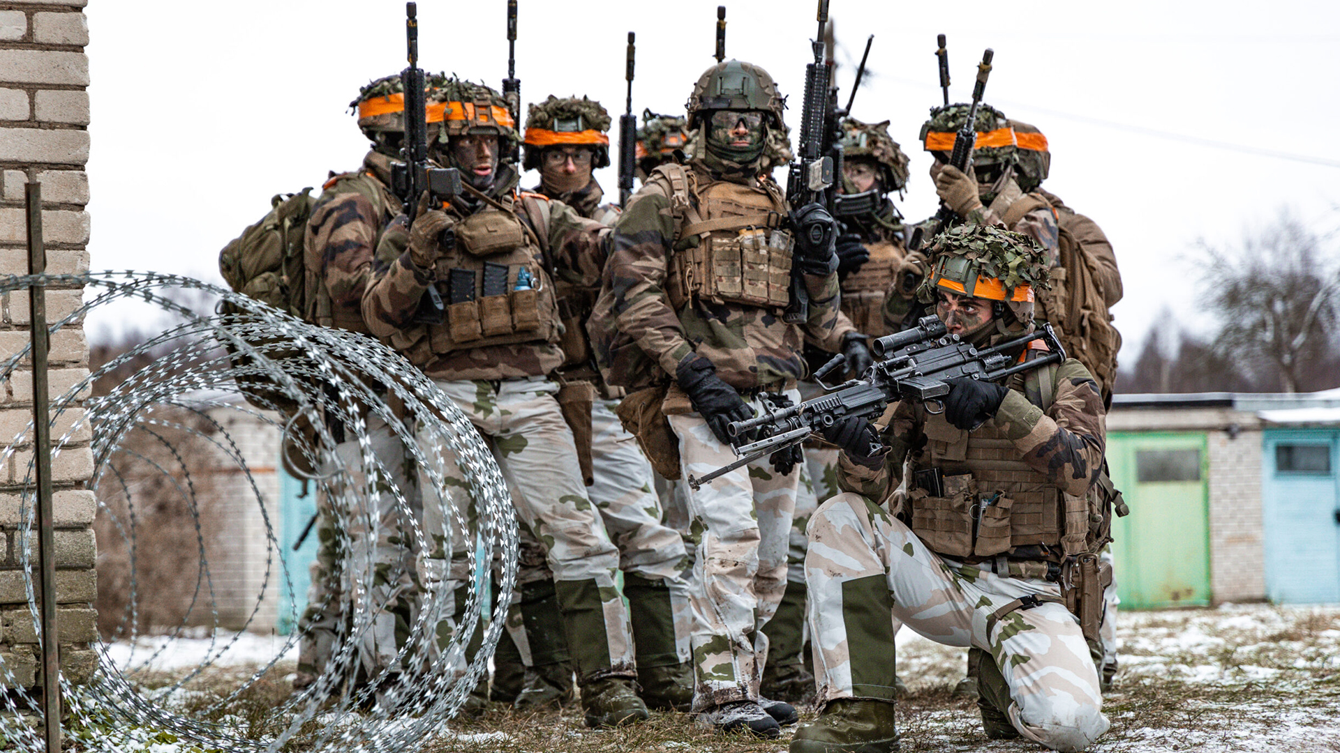 These soldiers prepare to play the opposing force during a FIBUA (fighting in built-up area) phase of the exercise