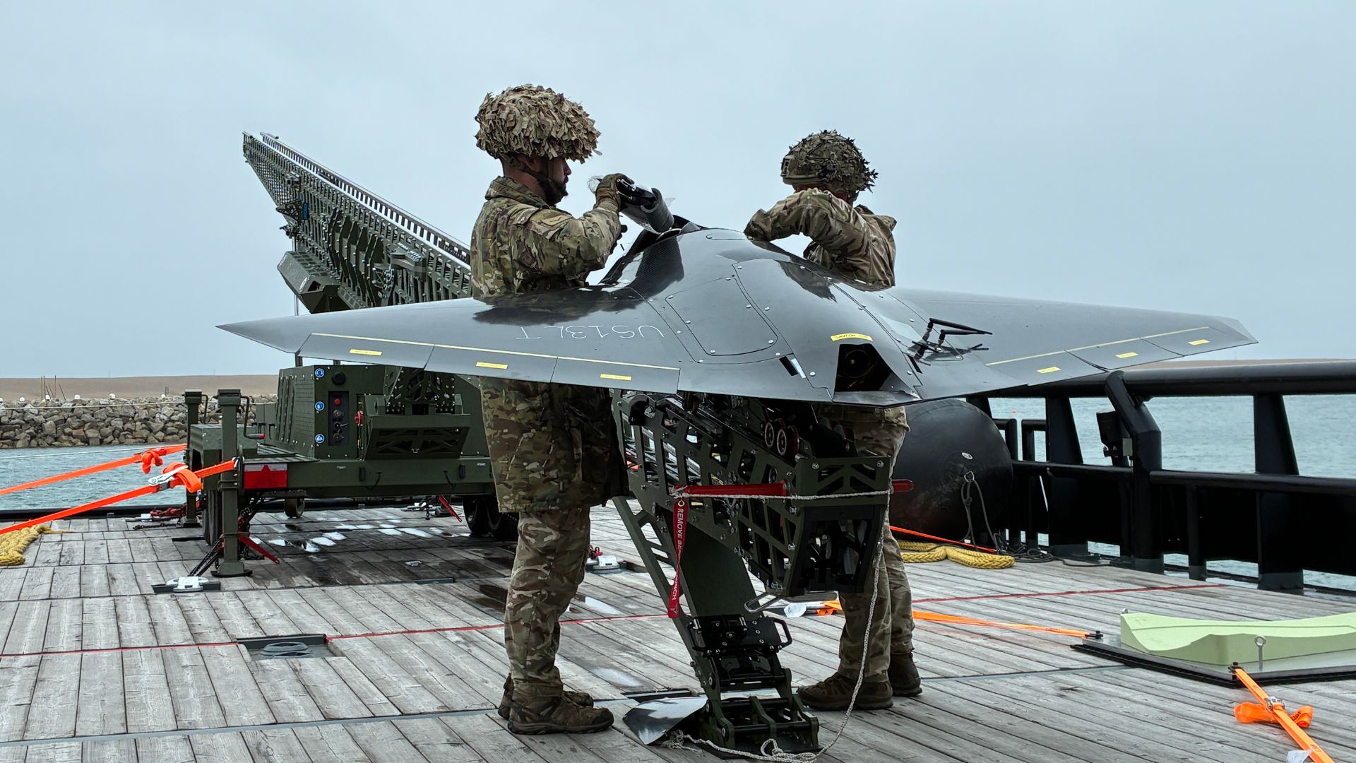 Personnel prepare to launch the Nyan One Way Effector Drone (Picture: Royal Navy)