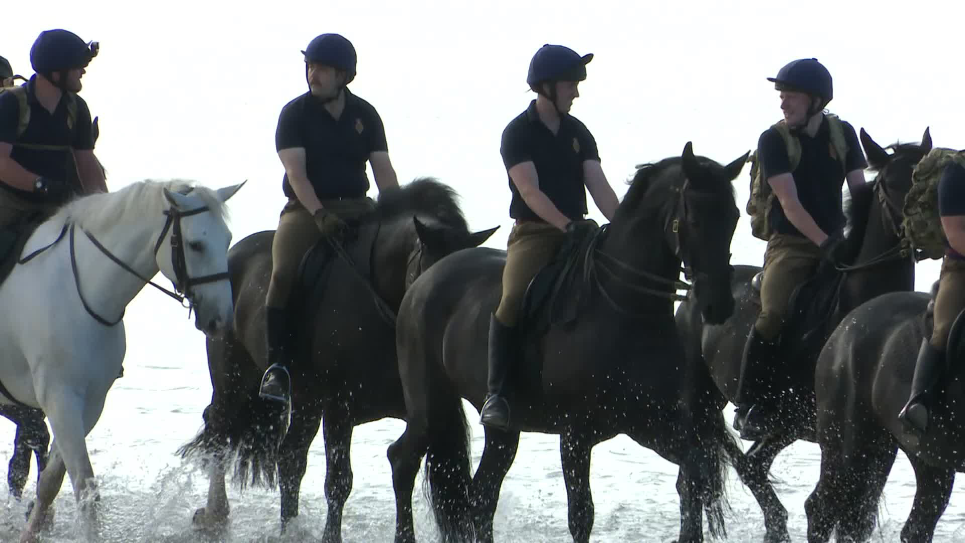 With their ceremonial duties over for the time being, it was time to soak up the sun and have a soak in the sea (Picture: BFBS)