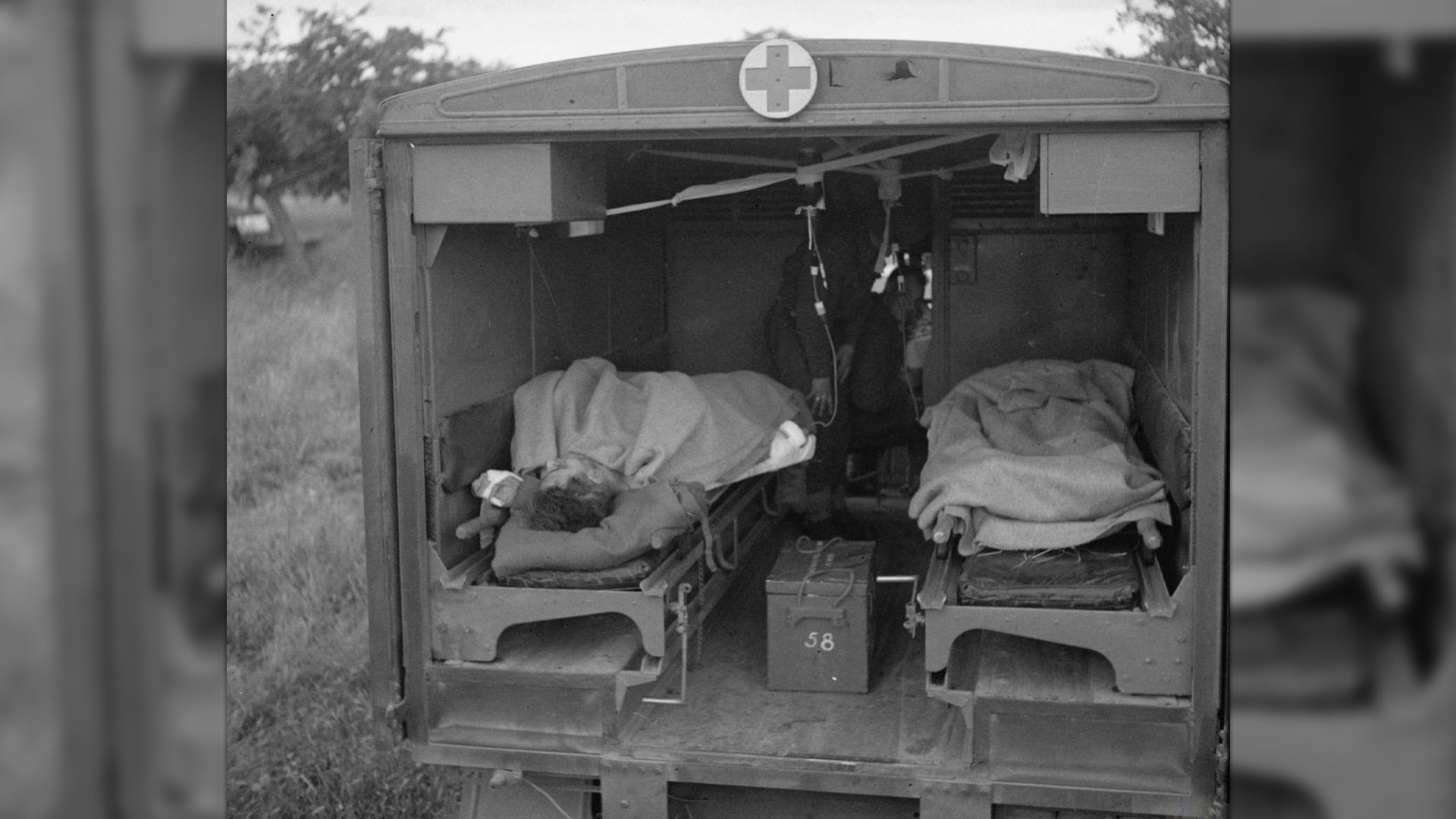 Soldiers at a Casualty Clearing Station in Normandy receiving blood transfusions in an ambulance as part of the Army Blood Transfusion Service in July 1944 (Picture: piemags/ww2archive)