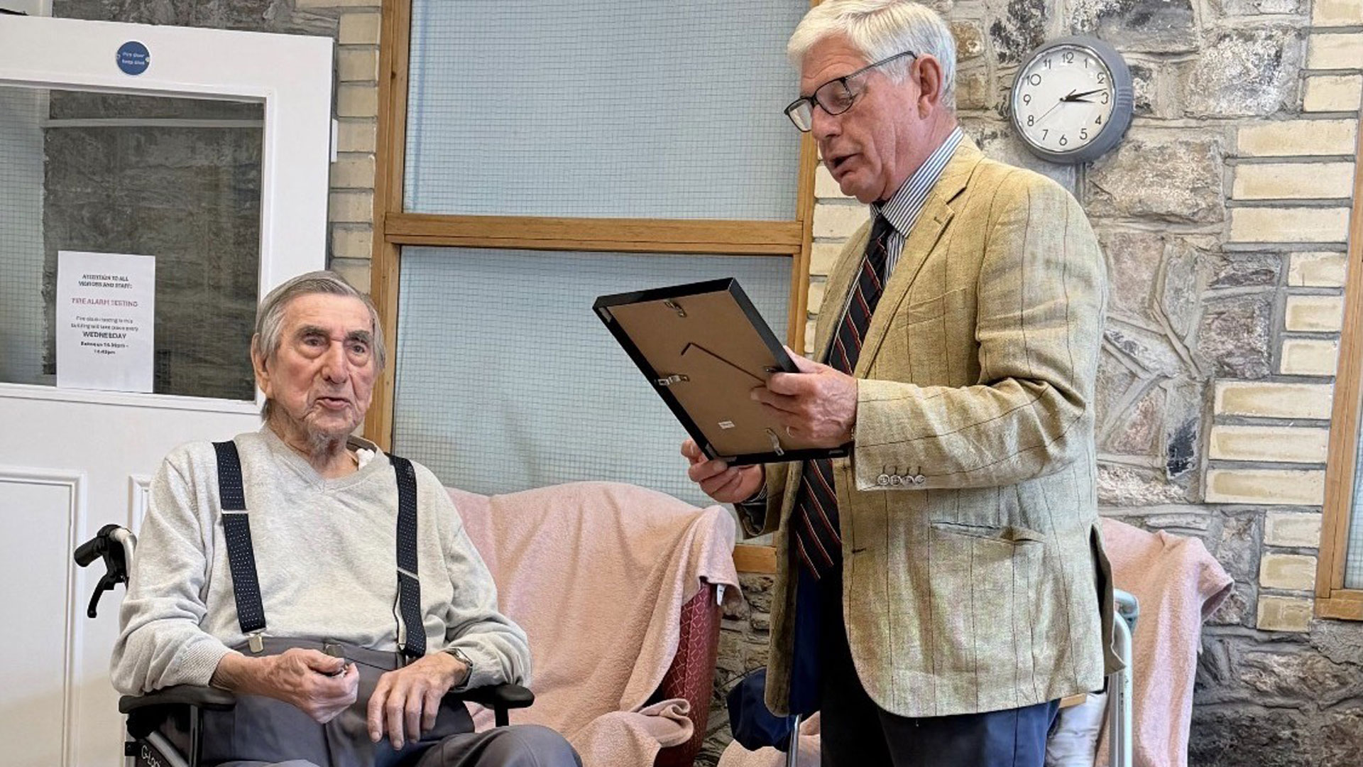 Giles Ebbutt reads the First Sea Lord's letter to Second World War veteran Fred Bickham (Picture: Royal Navy)