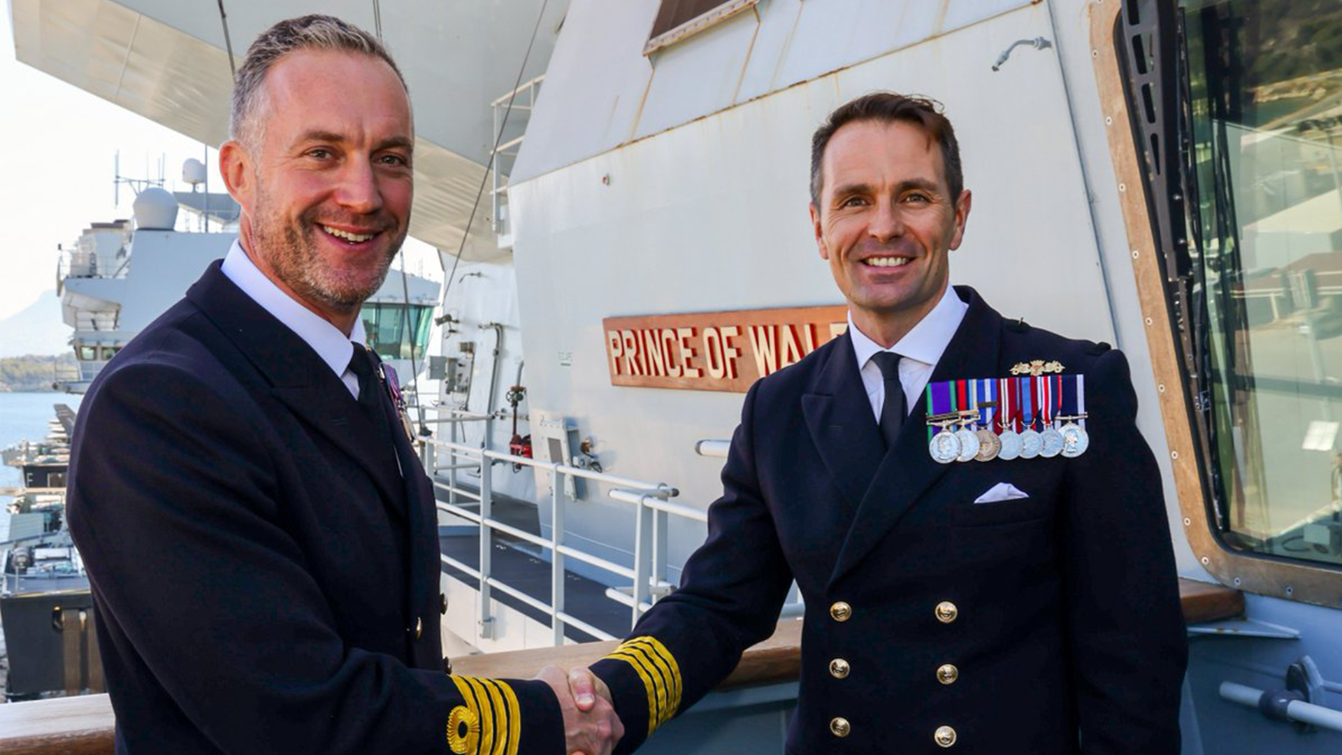 Captain Will Blackett handed over command of HMS Prince of Wales to Captain Ben Power