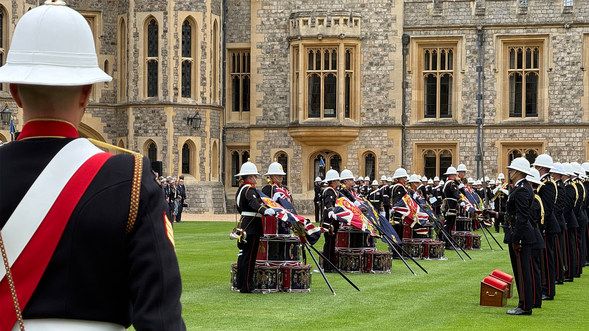 A senior NCO looks on as the new Colours are draped over the drum stacks of each of the four units - 40, 42, 43 and 45 Commando (Picture: BFBS)