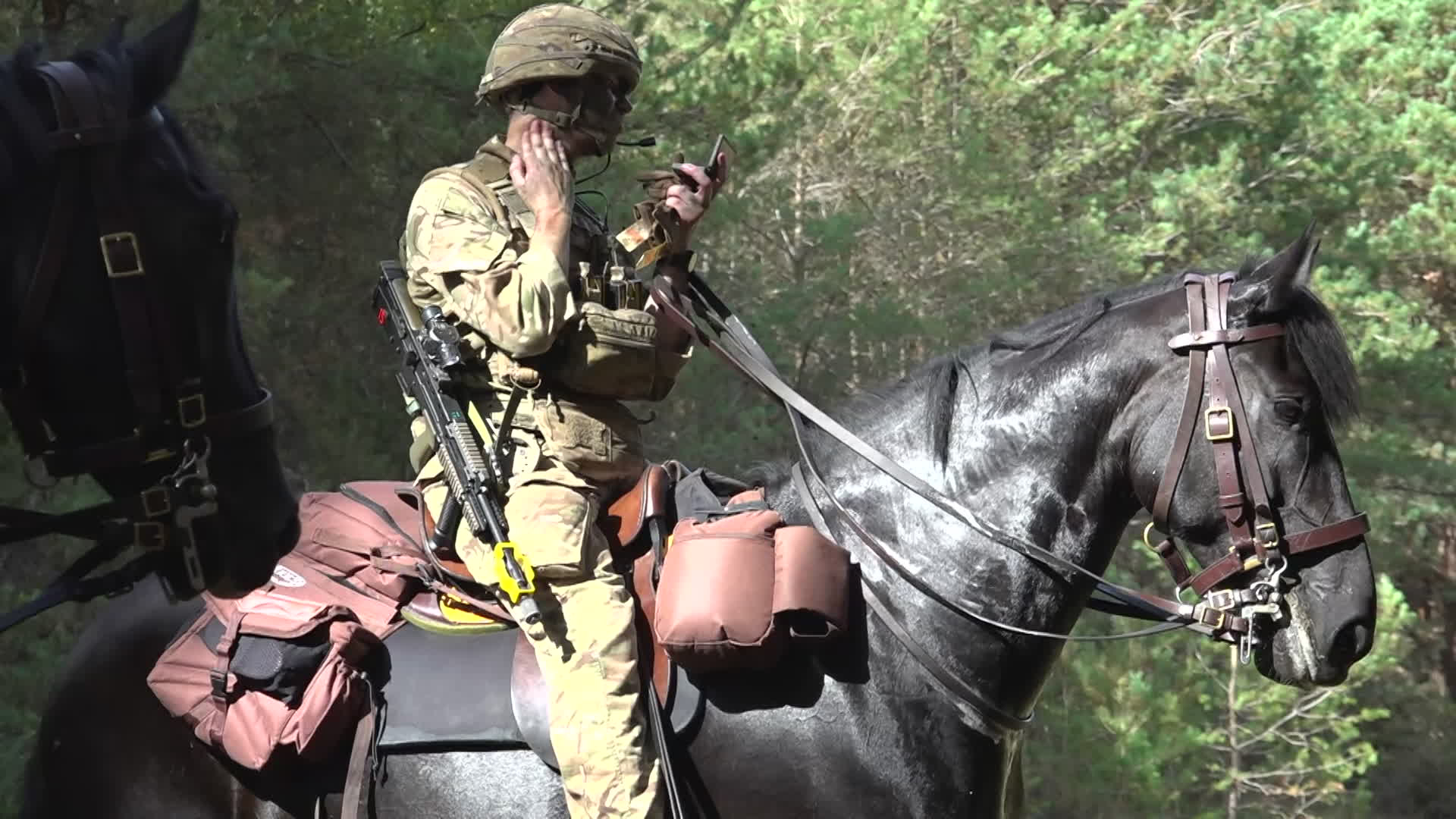 Having applied cam cream, the troopers found they could get close to simulated enemy positions before being spotted - one giveaway being the polished metal on the horses' tack (Picture: BFBS)