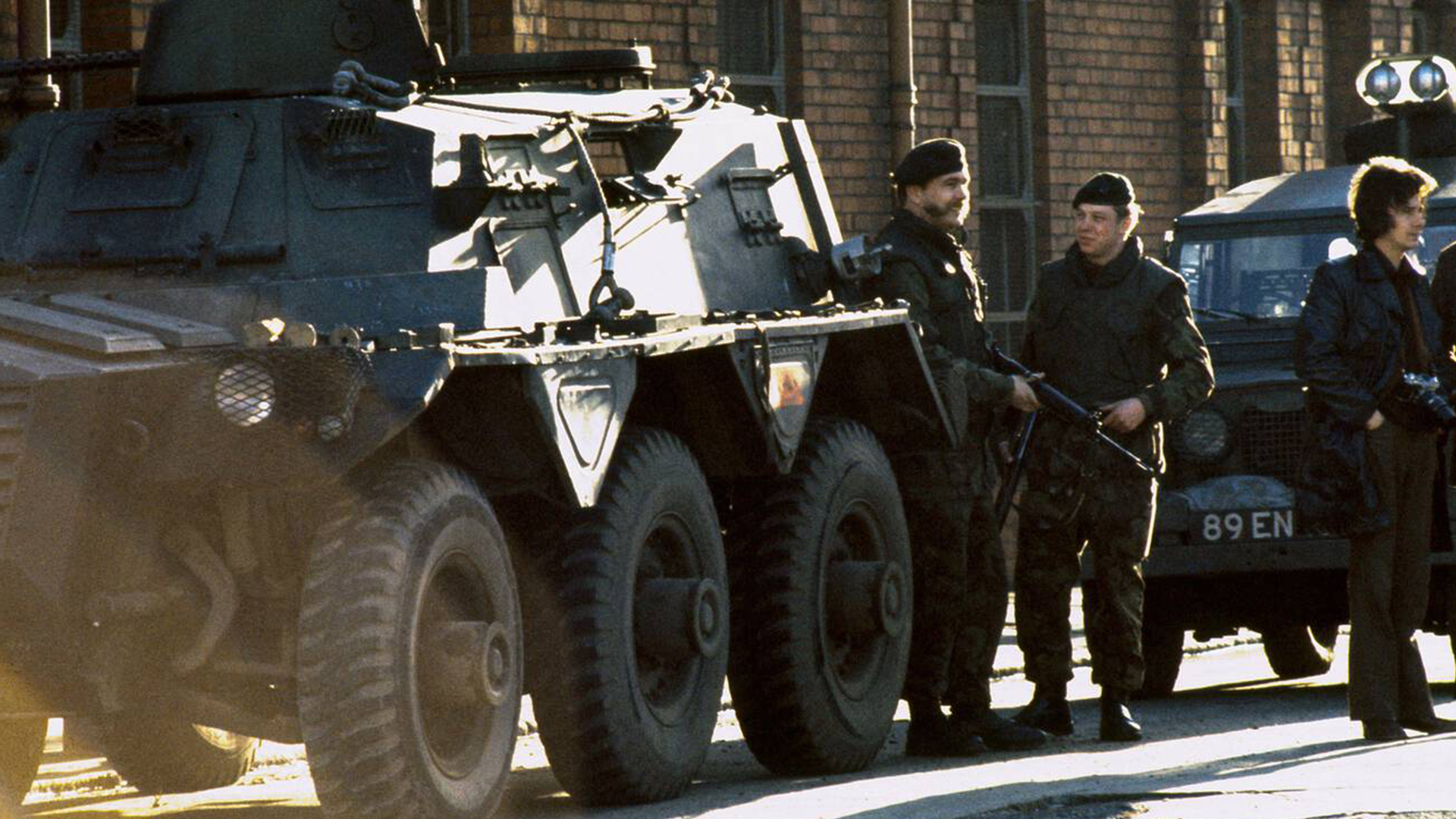 Soldiers supported by a Saracen armoured personnel carrier patrol a Catholic area of Belfast in 1973 - over half a century later the Troubles Bill may soon become law (Picture: Alamy)