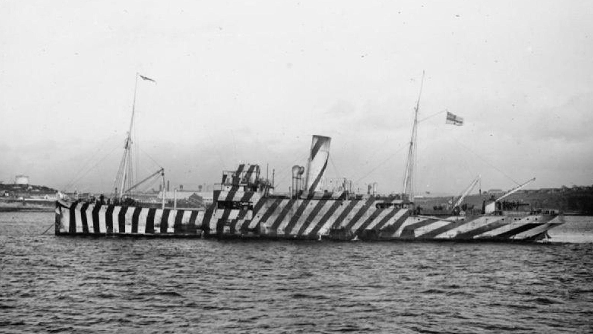 080825 HMS Underwing at anchor with guns exposed and striped dazzle camouflage