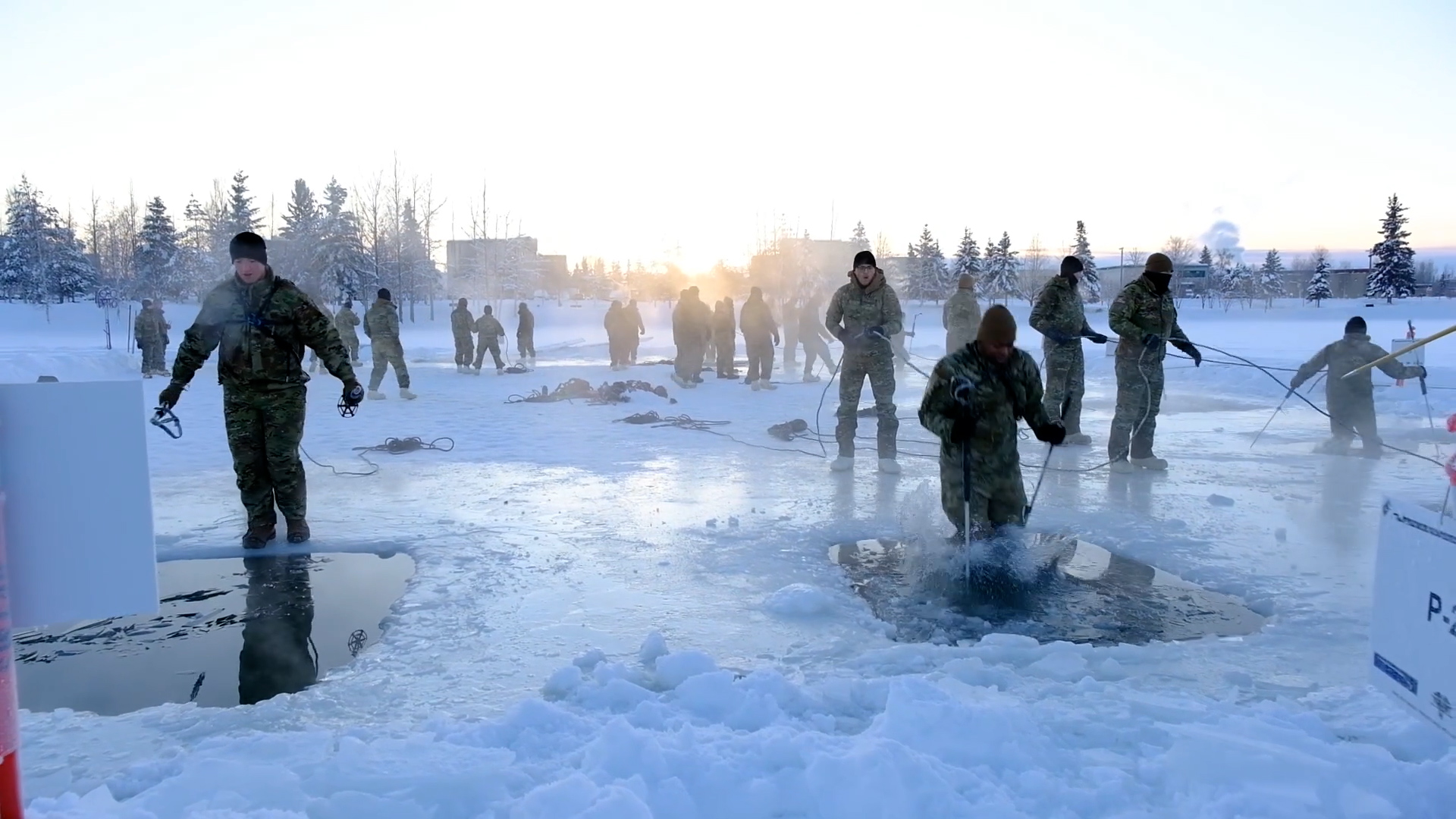Soldiers conduct ice breaking drills to prepare them from the real risk of falling through the ice