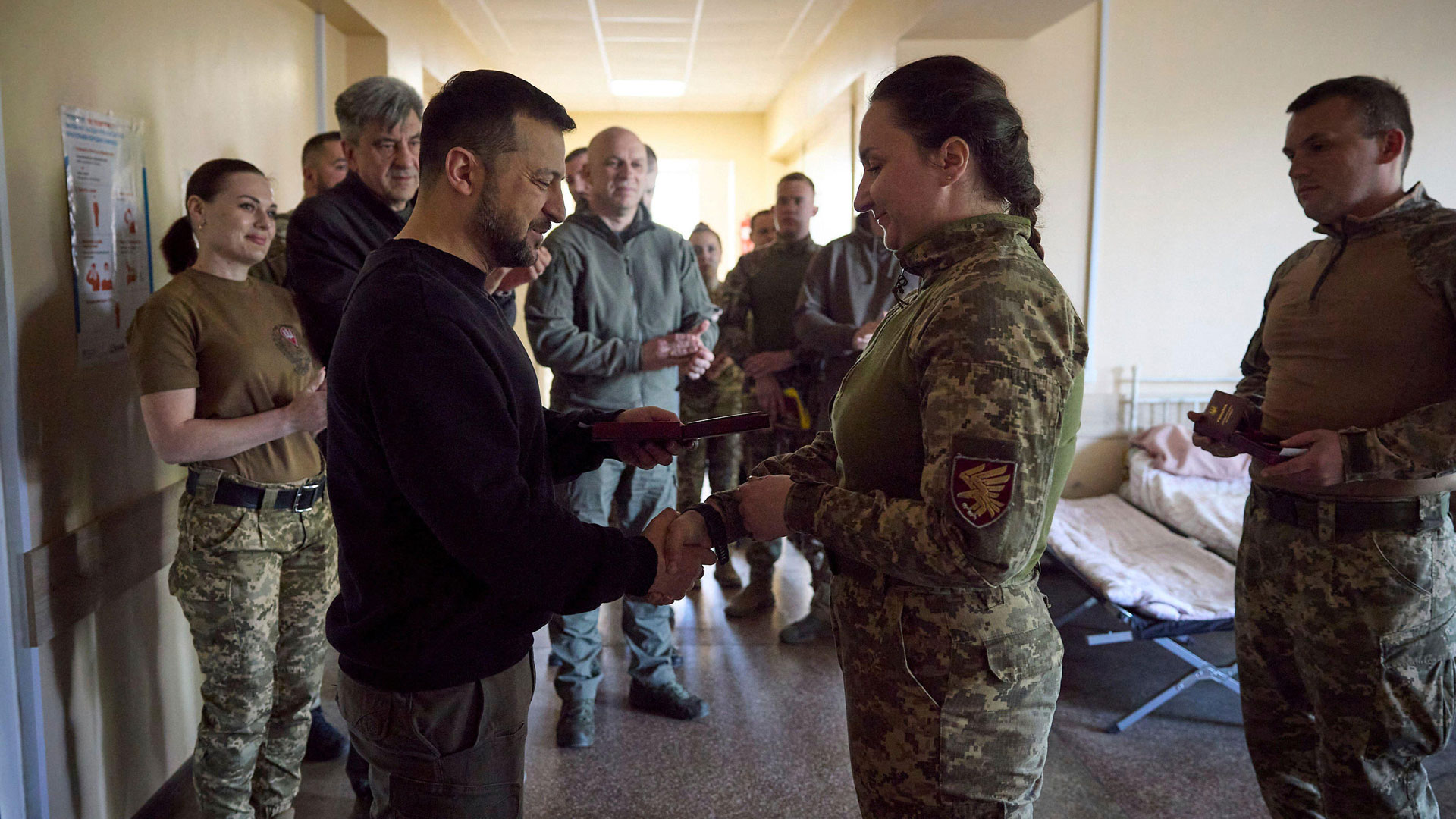 President Volodymyr Zelenskyy awards a medal to a Ukrainian female soldier in April 2023 (Picture: Ukraine Presidents Office)