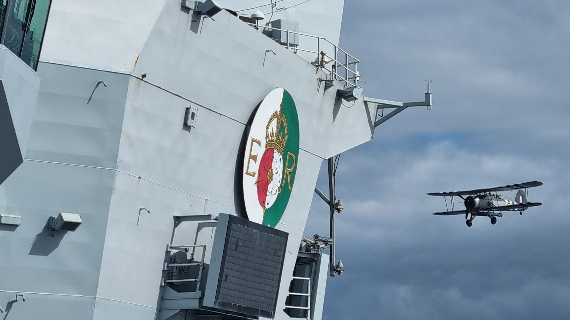 The 65,000-tonne aircraft carrier's crew caught a glimpse of the Stringbag from the flight deck (Picture: HMS Queen Elizabeth X)