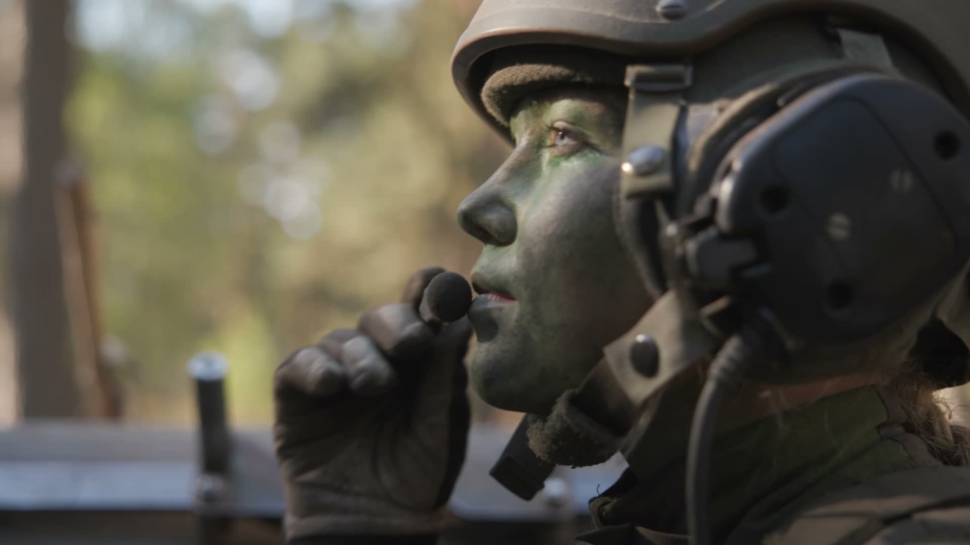female personnel member in green face paint on Exercise Aurora CREDIT NATO