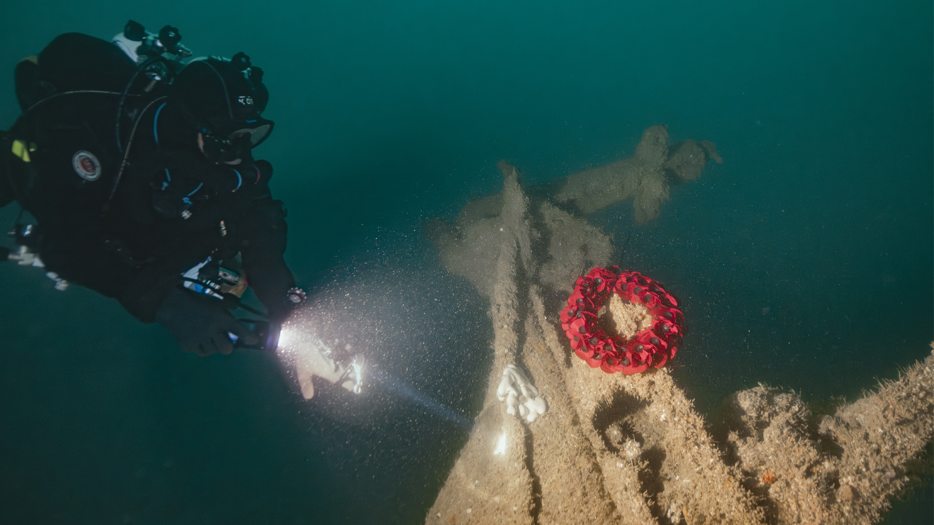 110826 Guy Trees  laying wreath on tiler of HMS Tiger CREDIT Ricardo Constantino 