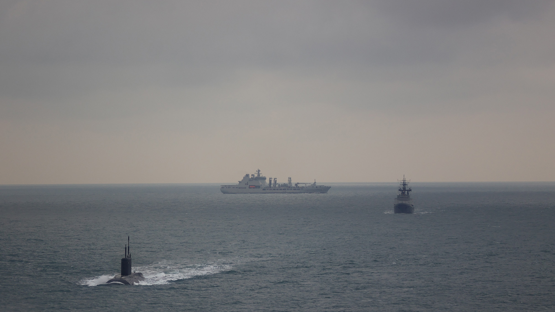 A Merlin helicopter from 814 Naval Air Squadron and RFA tanker Tidesurge followed the Russian submarine Krasnodar