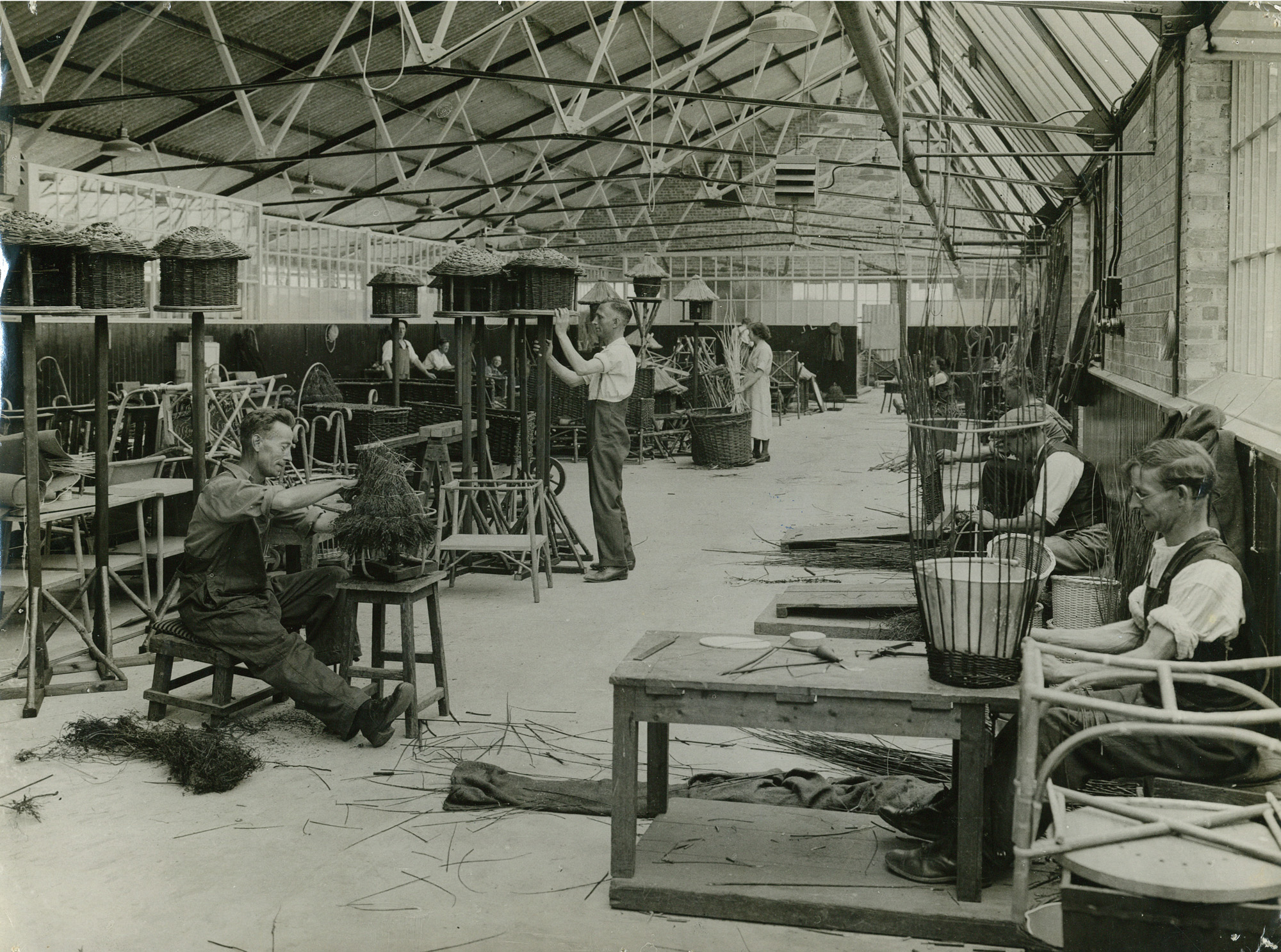 Inside the Bernhard Baron Basketry Workshop at the Enham Village Centre for disabled ex-Service men, c1935