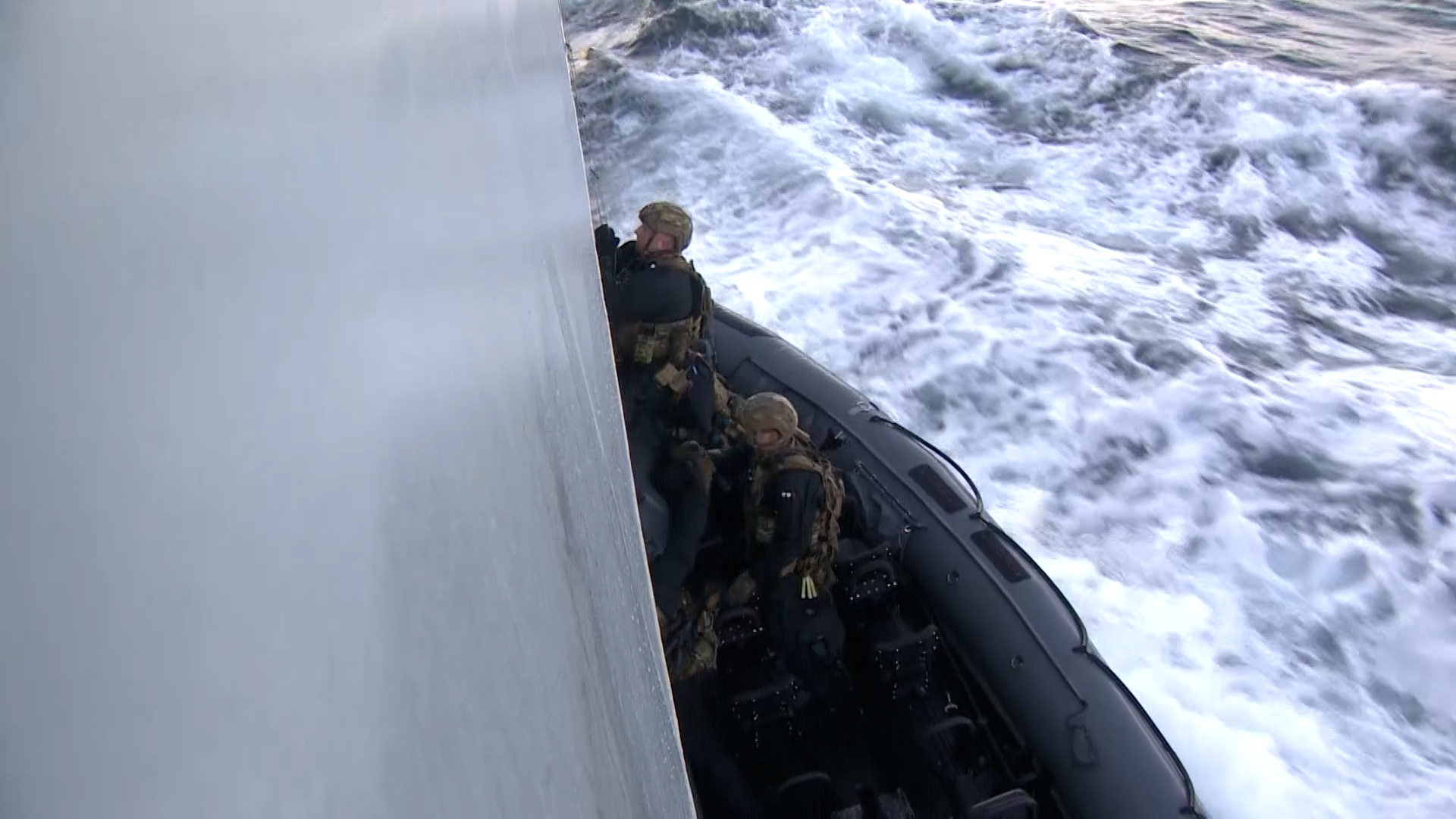 Boarding a ship by coming alongside in a RIB is problematic as it forces the boarding team to use ladders while carrying weapons and kit