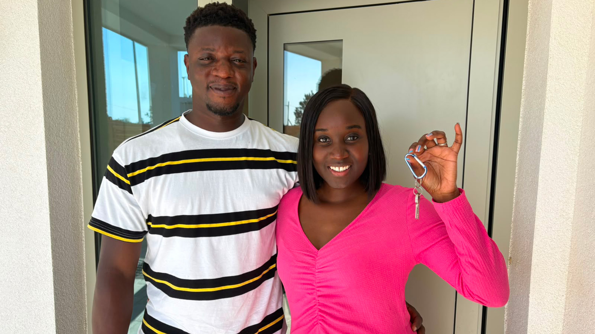 Karen-Grace and Stephen Agyekum pose with the keys to their new house (Picture: BFBS)