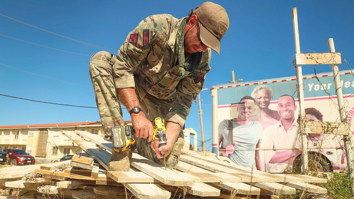 Crisis Response Troop repair damaged roofing at Falmouth Hospital. Personnel deployed on HMS Trent in the Caribbean to provide disaster relief MOD