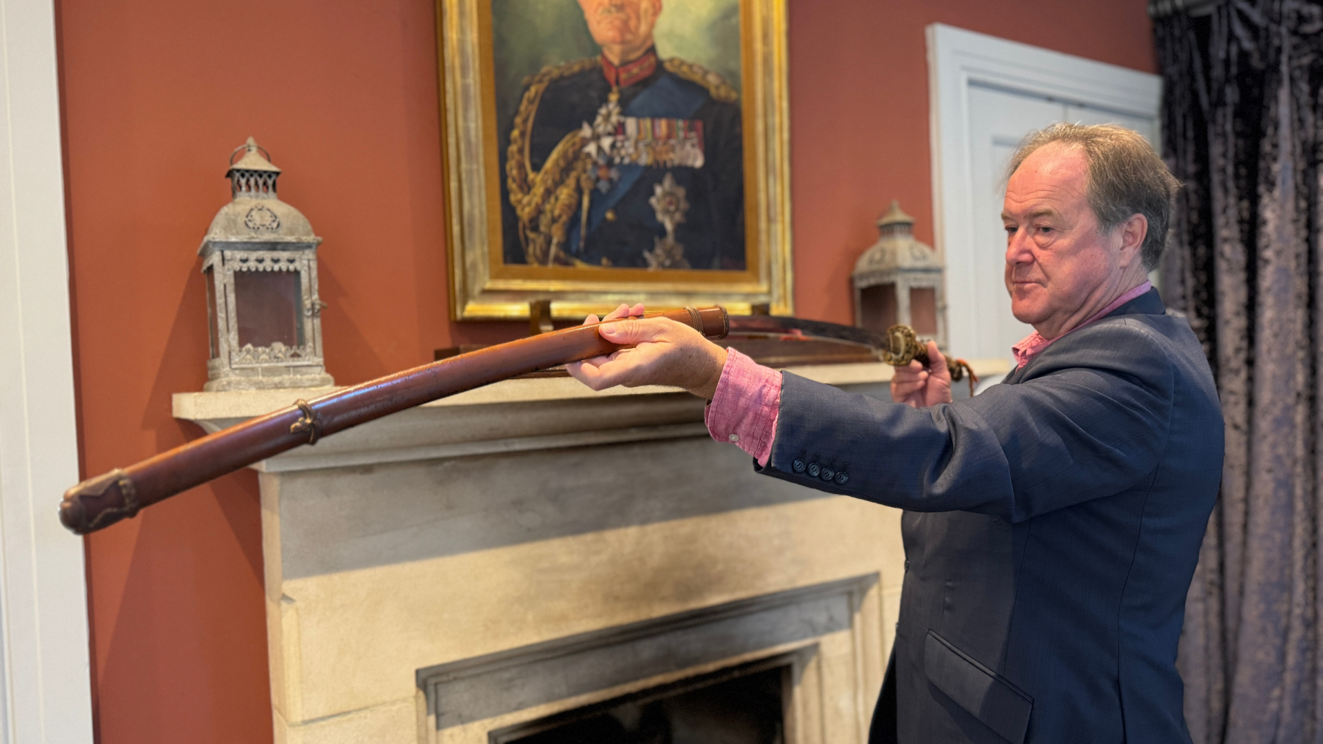 Viscount Mark Slim holds a sword his grandfather Field Marshal William Slim obtained from a Japanese Imperial commander during his leadership of the Fourteenth Army in Burma