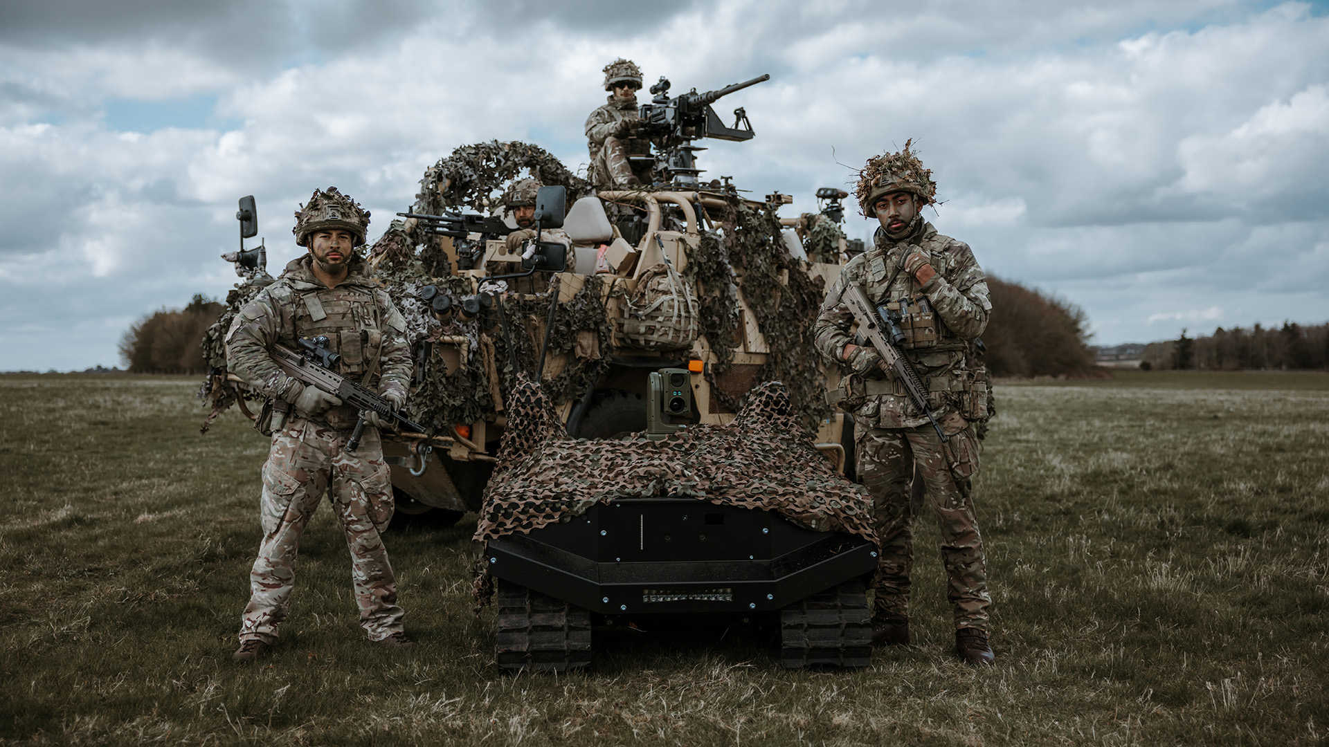 Soldier pose with one of the uncrewed ground vehicles from ARX Robotics CRED ARX Robotics