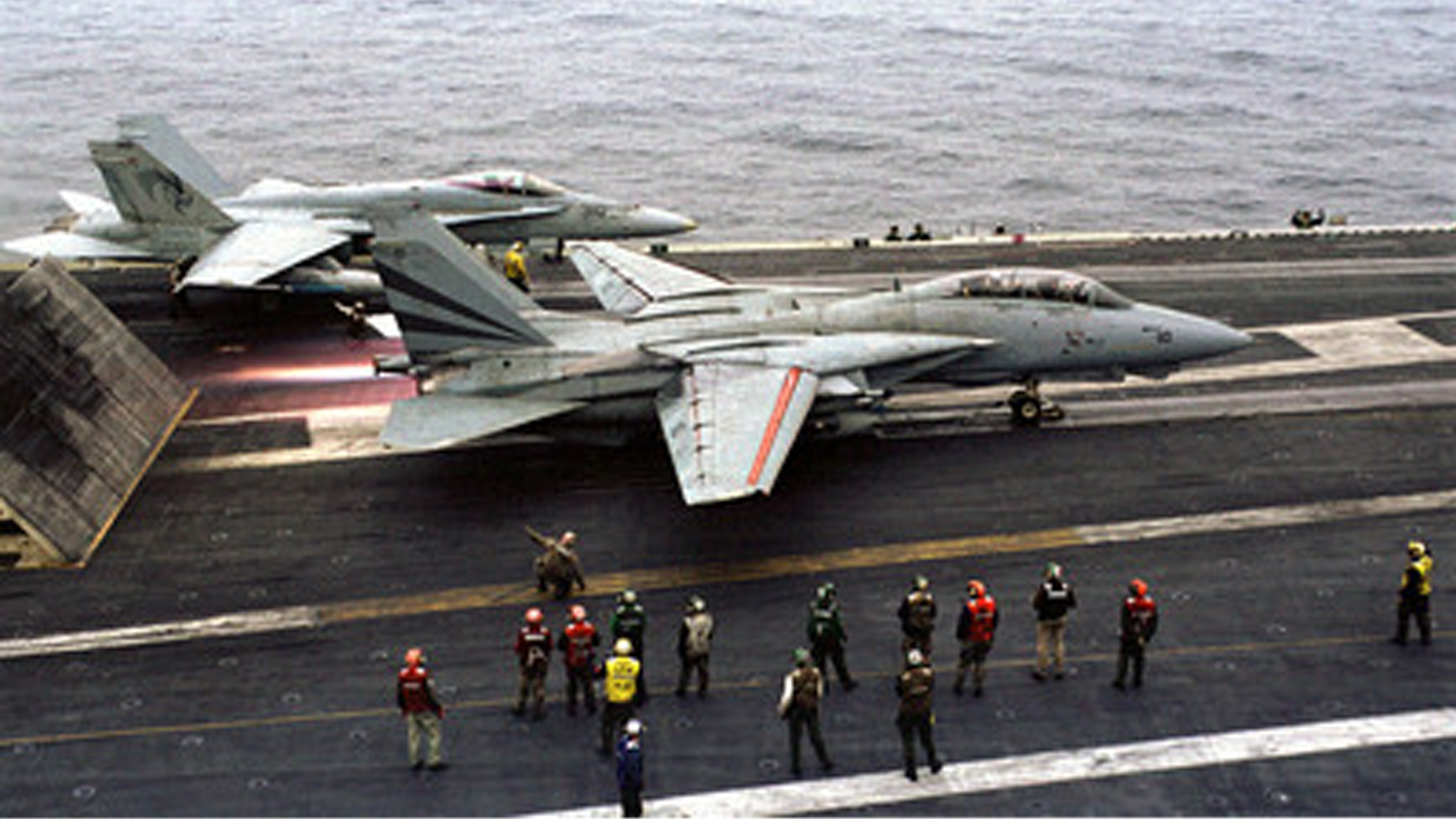 F-14 Tomcat hits the afterburner before launching from the aircraft carrier USS Kitty Hawk during Exercise Foal Eagle in 1999