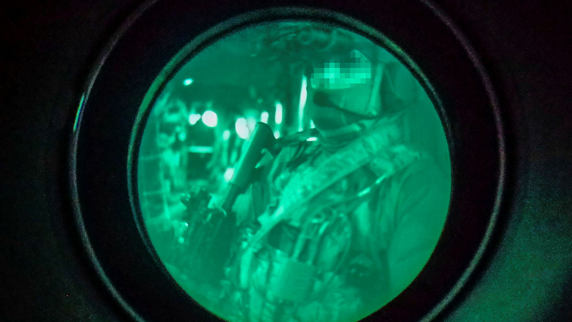 The marines from Kilo Company, seen here through a night vision device, were armed with their usual L119 Colt Canada C8 assault rifles (Picture: MOD)