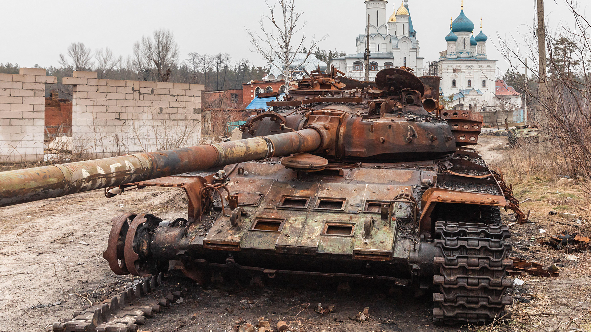 The explosive reactive armour failed to protect this Russian T-72 that was knocked out in Svyatogirsk - Russia has been struggling to use combined arms tactics effectively (Picture: Alamy)