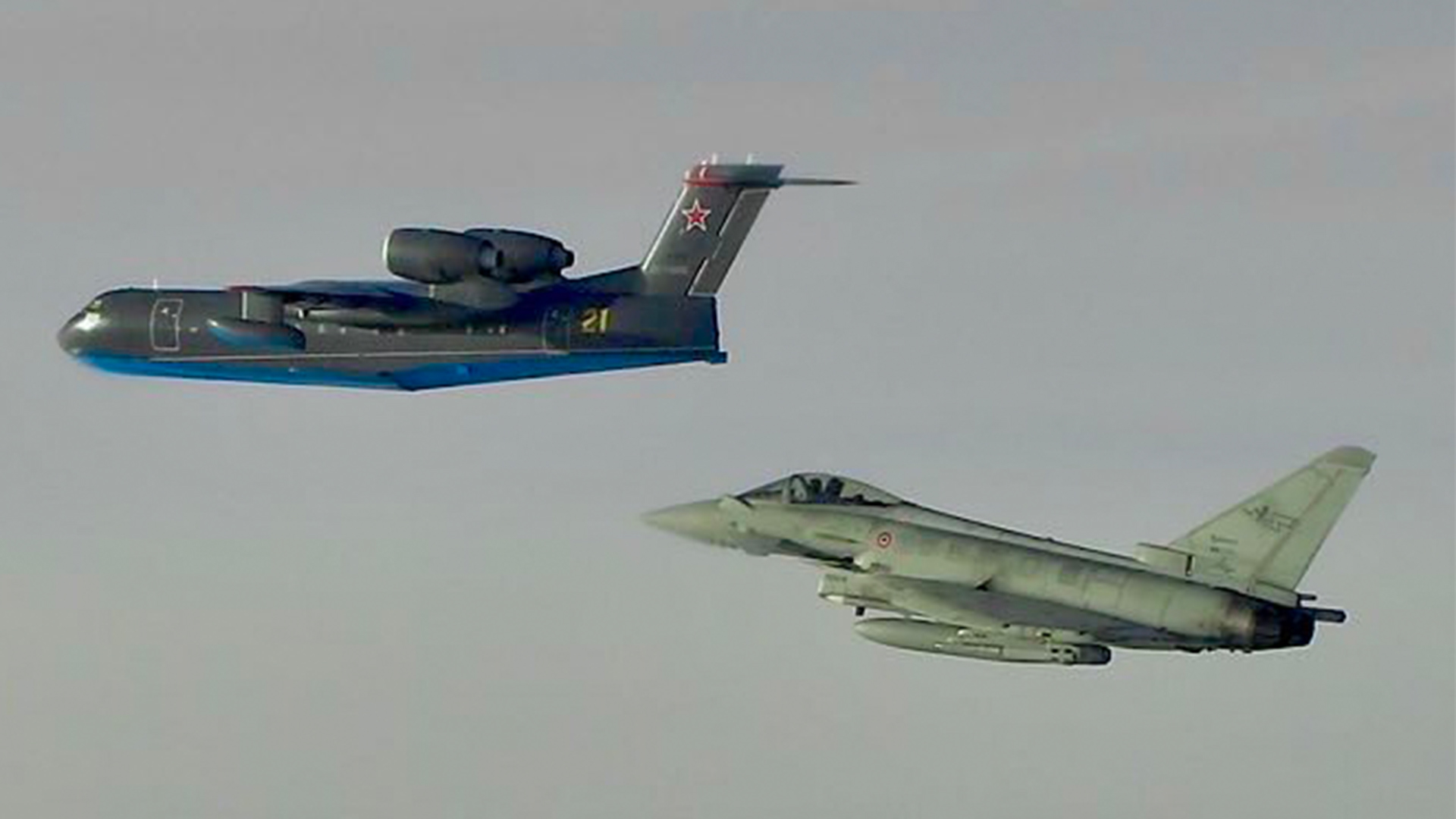The Italian jets keep a watchful eye on the Altair - note the unusual location of the engines