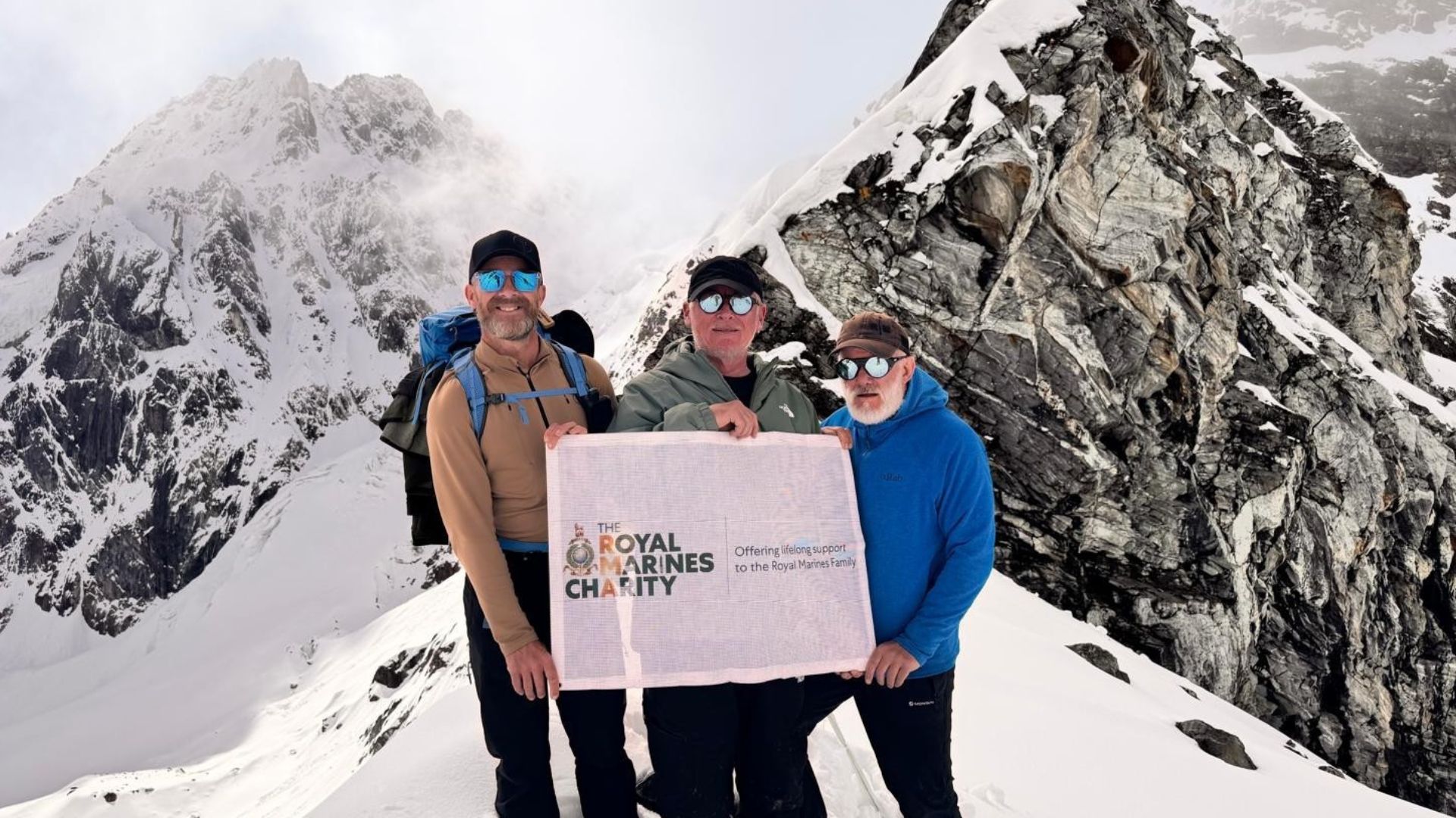 Former Royal Marines Aldo Kane (left), Al Chambers and Billy Perham traversing one of the 11 mountain passes (Picture: RMA – Royal Marines Charity)