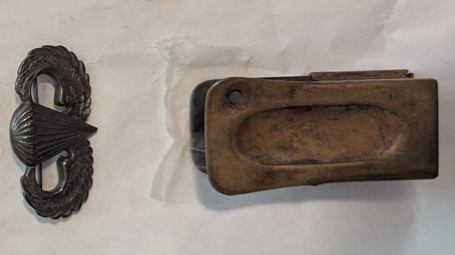 181125 Paul Holler's clicker and his US Army WW2 paratrooper jump wings CREDIT Paul Holler's family