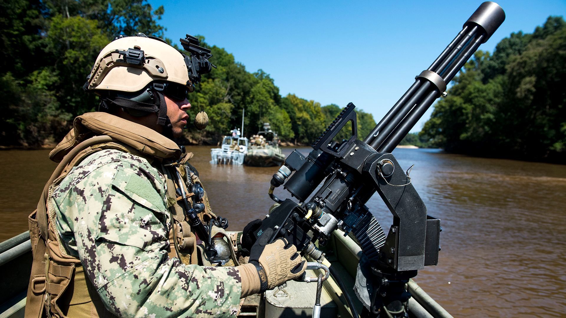 The minigun is employed across the various branches of the US military, the one seen here being crewed by a US Navy NCO aboard a Riverine Patrol Boat