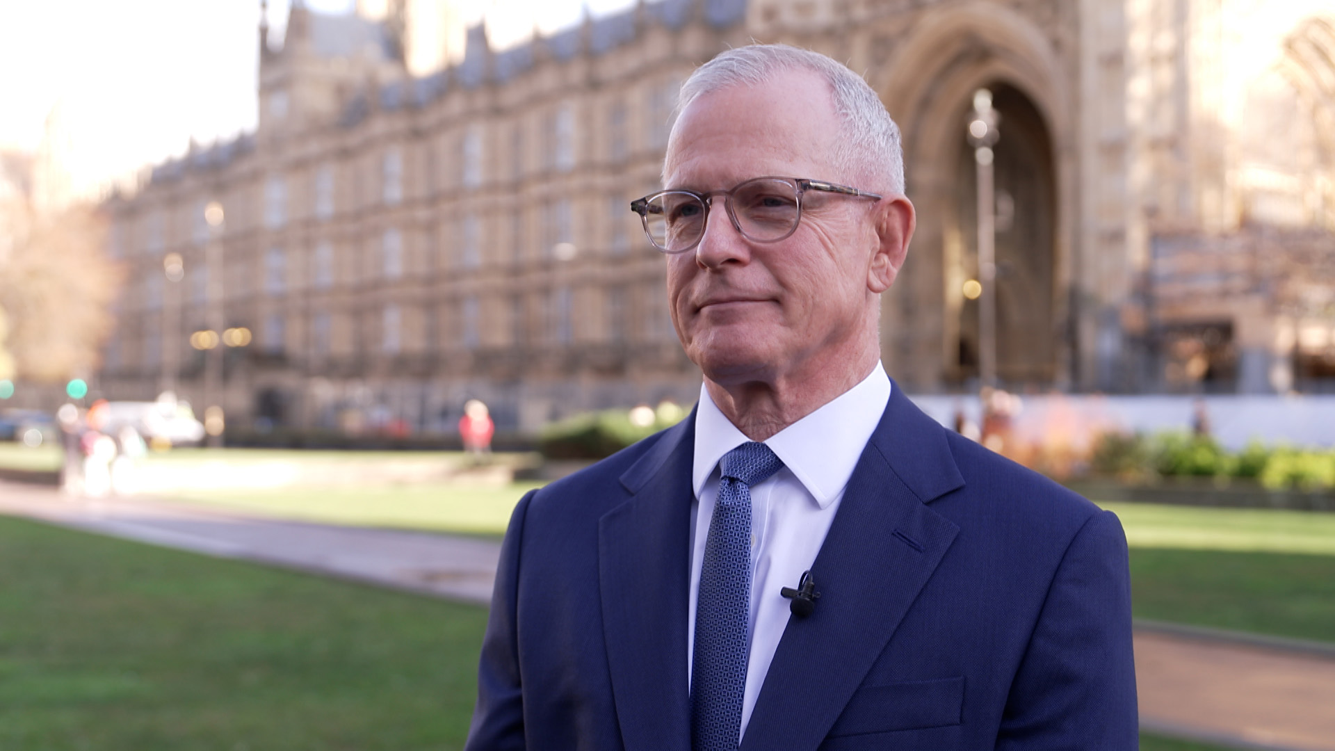 Lord Paddick stands outside the Houses of Parliament 