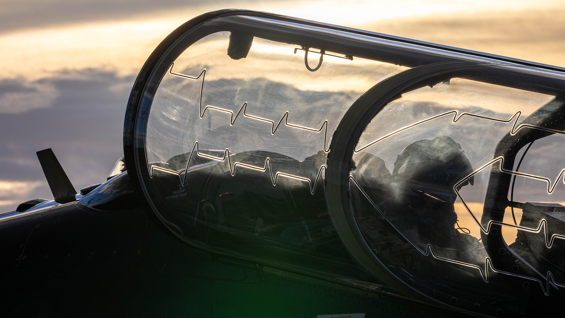 The pilot of a IV (AC) Squadron Hawk T2 from RAF Valley straps in ready for a sortie from Solenzara Air Base in Corsica on Exercise Freedom Hawk