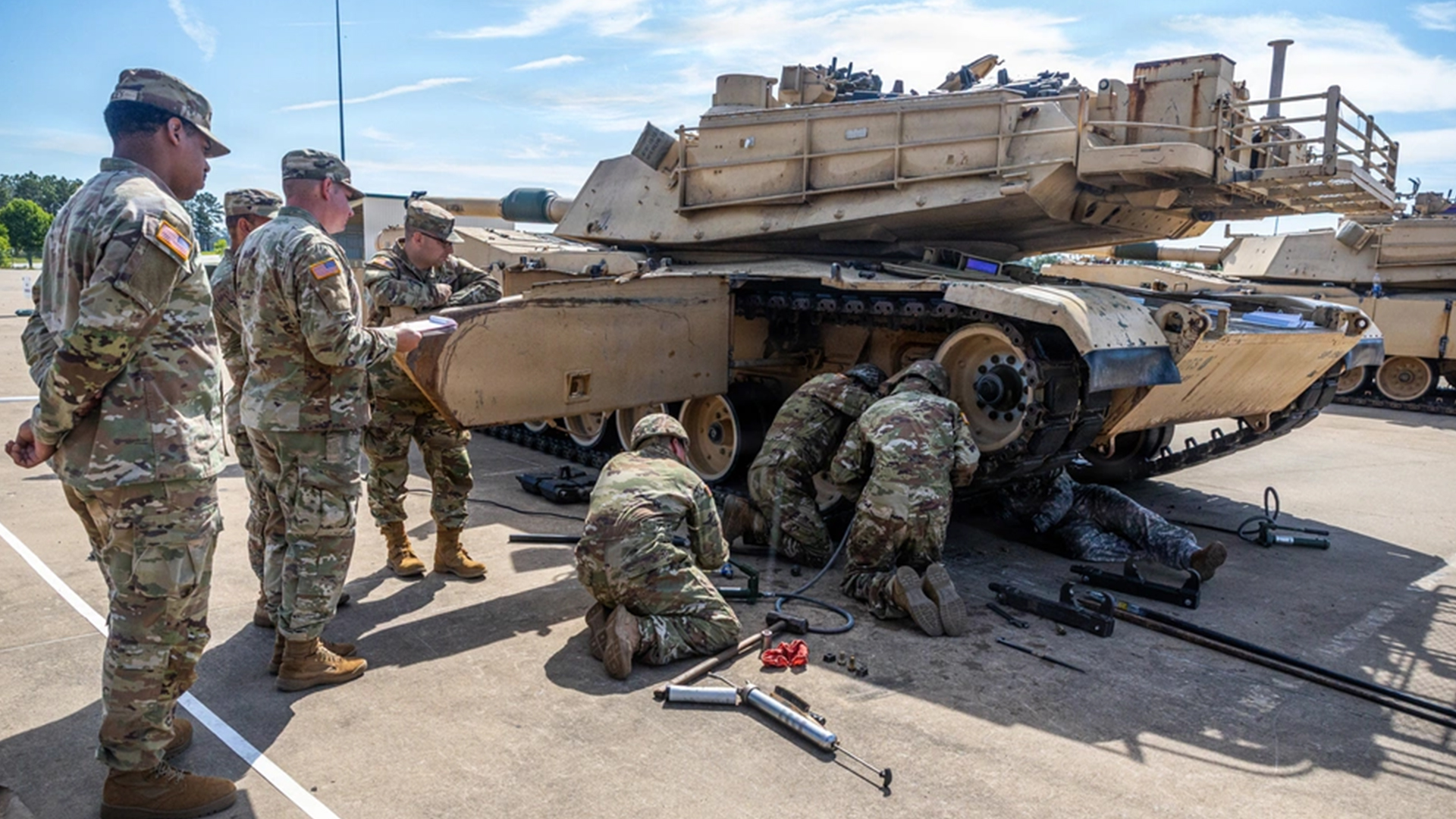 The Sullivan Cup also featured an armour category, with this team taking part in the vehicle maintenance test with an M1A2 Abrams main battle tank (Picture: US Department of War)