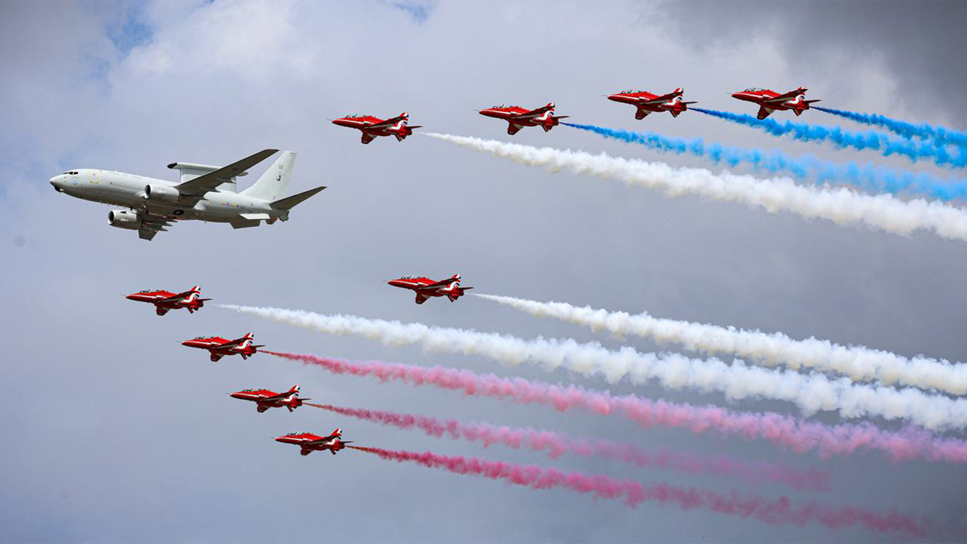 The iconic Red Arrows display team performing with the Wedgetail AEW Mk1 at the Royal International Air Tattoo in Fairford
