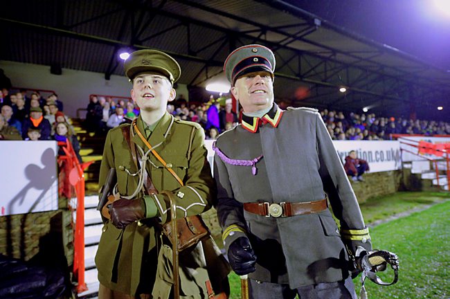 First World War re-enactors at a modern football game honouring the memory of the 1914 Christmas Truce