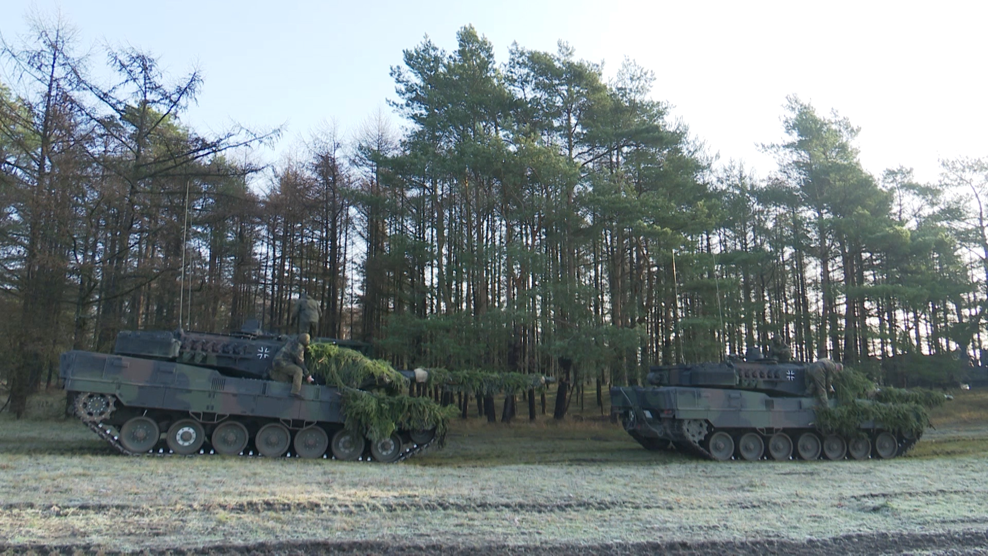 Two Leopard 2 tanks sit on training range in Germany 111219 CREDIT BFBS.