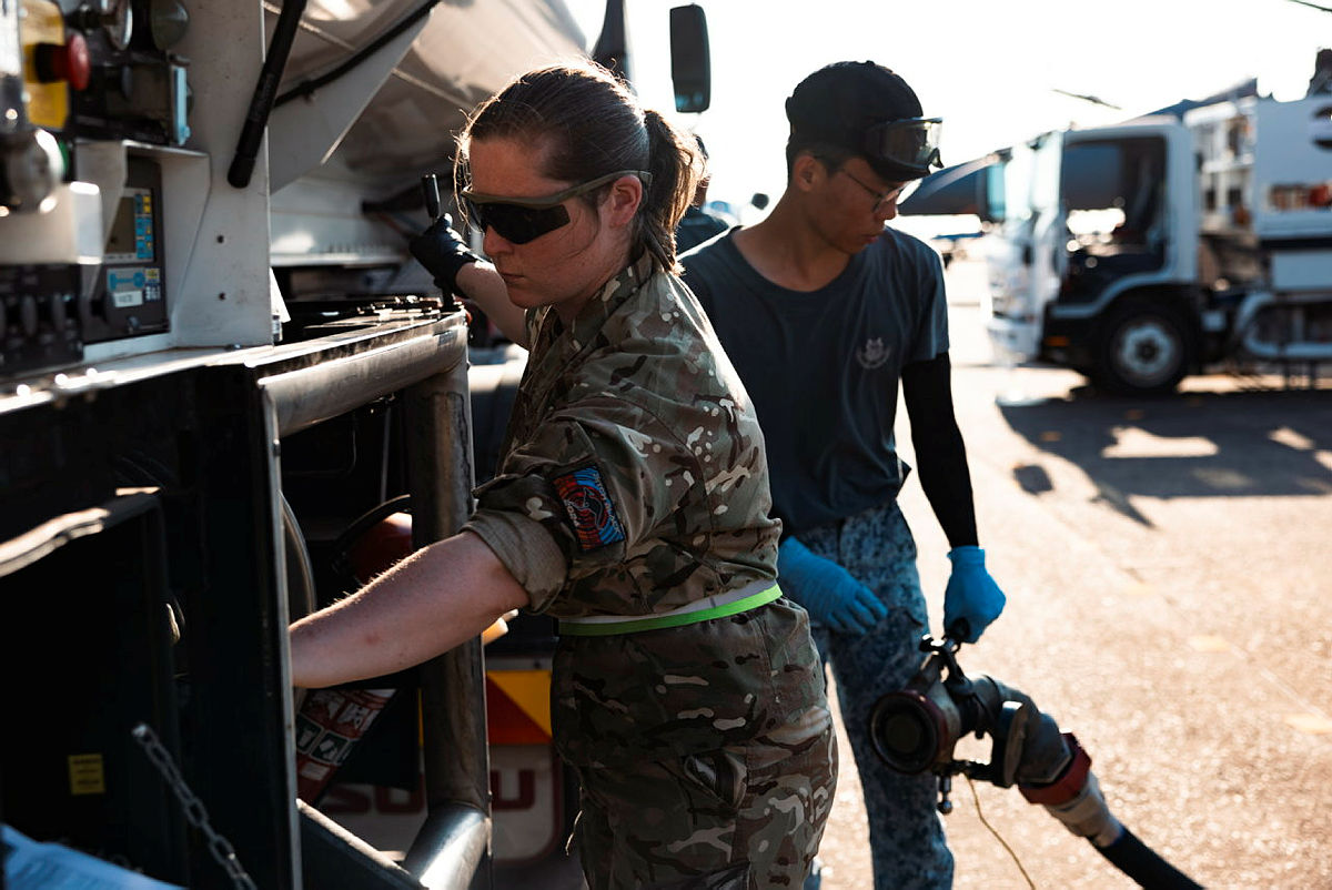 An RAF Driver refuelling an aircraft alongside a foreign counterpart during Exercise Pitch Black 2024 (Picture: MOD)