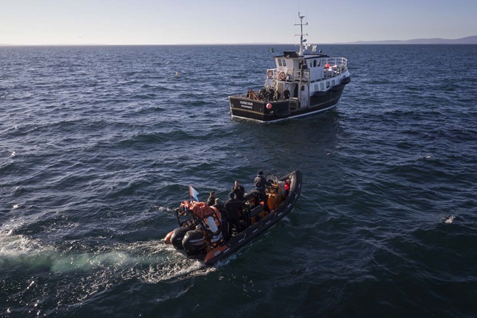 Royal Navy and civilian divers approach site of HMS Royal Oak