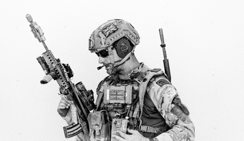 a Royal Marine from Alpha Company 40 Commando, radios up a situation report during a firefight. Taken in California at 29 Palms on exercise Green Dagger 2019.