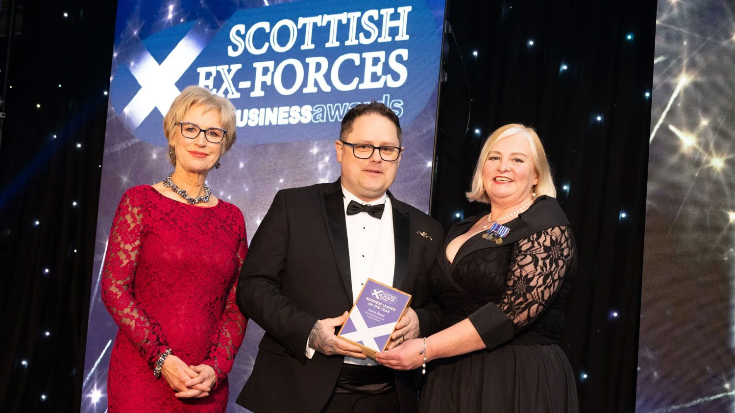 2024 Business Leader of the Year winner David Wood of Drumfork Nursery & Forest School is pictured with broadcaster Sally Magnusson, left, and Susie Hamilton, Scottish Veterans Commissioner CREDIT Forces in Business Awards