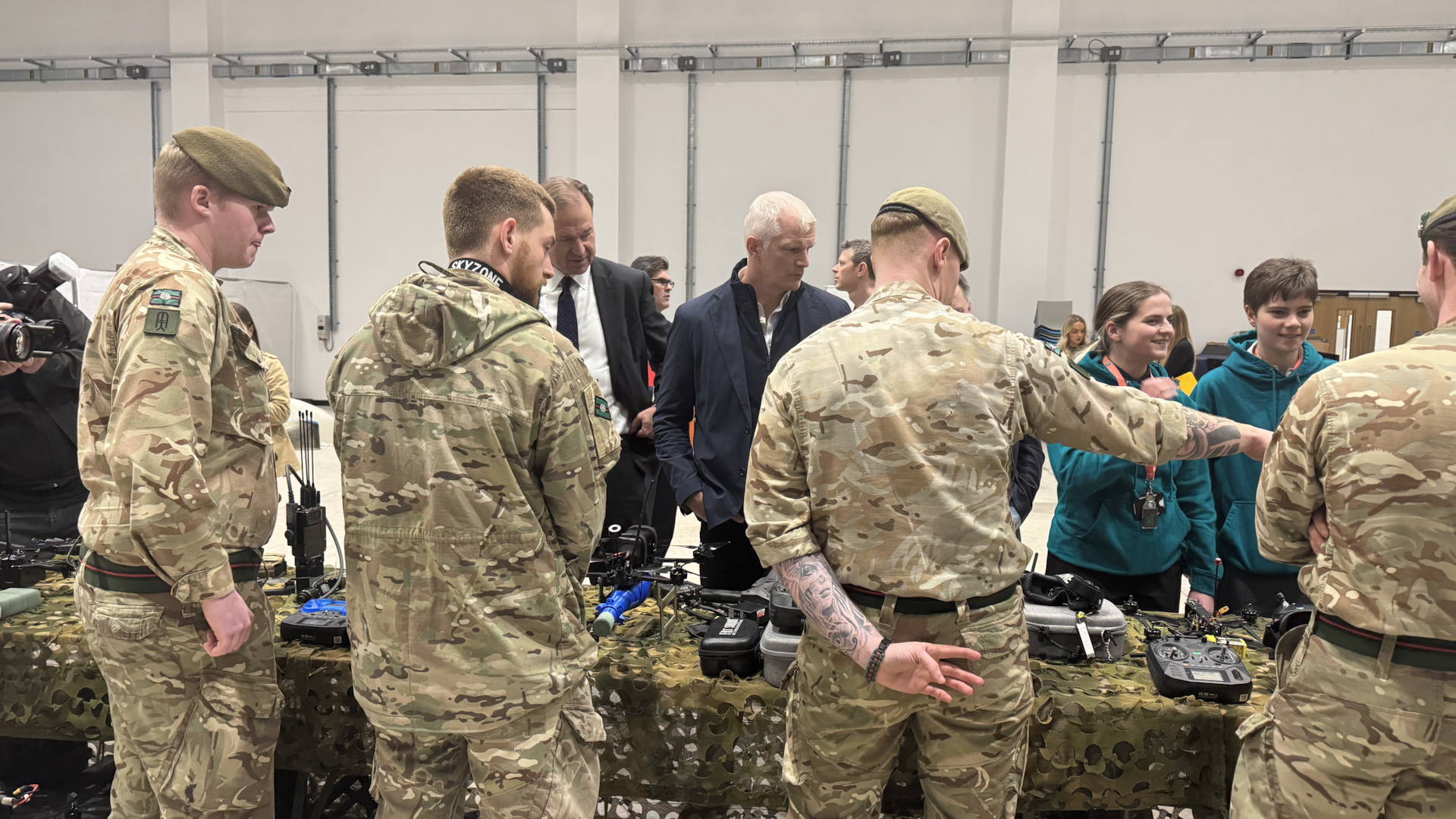 The Armed Forces Minister Al Carns looks over the drones at the event