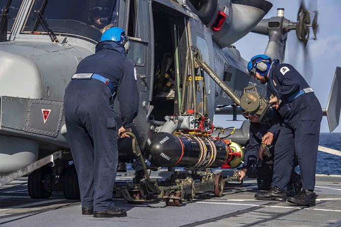 208 Flight load a TVT onto a Wildcat (Picture: Royal Navy).